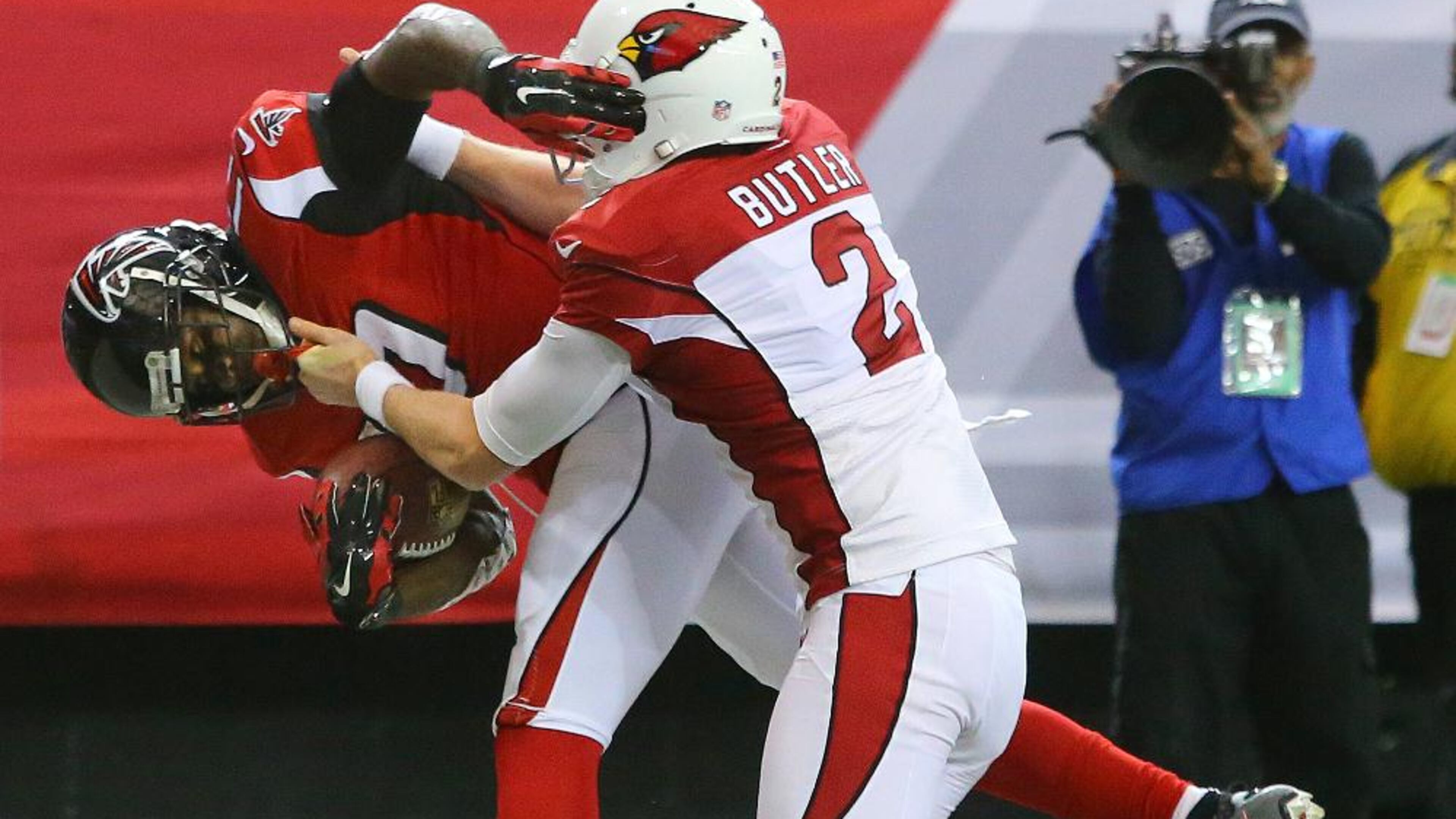 113014 ATLANTA: Falcons Devin Hester gets in the endzone past Cardinals punter Drew Butler returning the punt all the way, but it was negated by a penalty during the first quarter in an NFL football game on Sunday, Nov. 30, 2014, in Atlanta. CURTIS COMPTON / CCOMPTON@AJC.COM Devin Hester's punt return for a touchdown was wiped out by a disputed facemask penalty. (Curtis Compton/AJC)