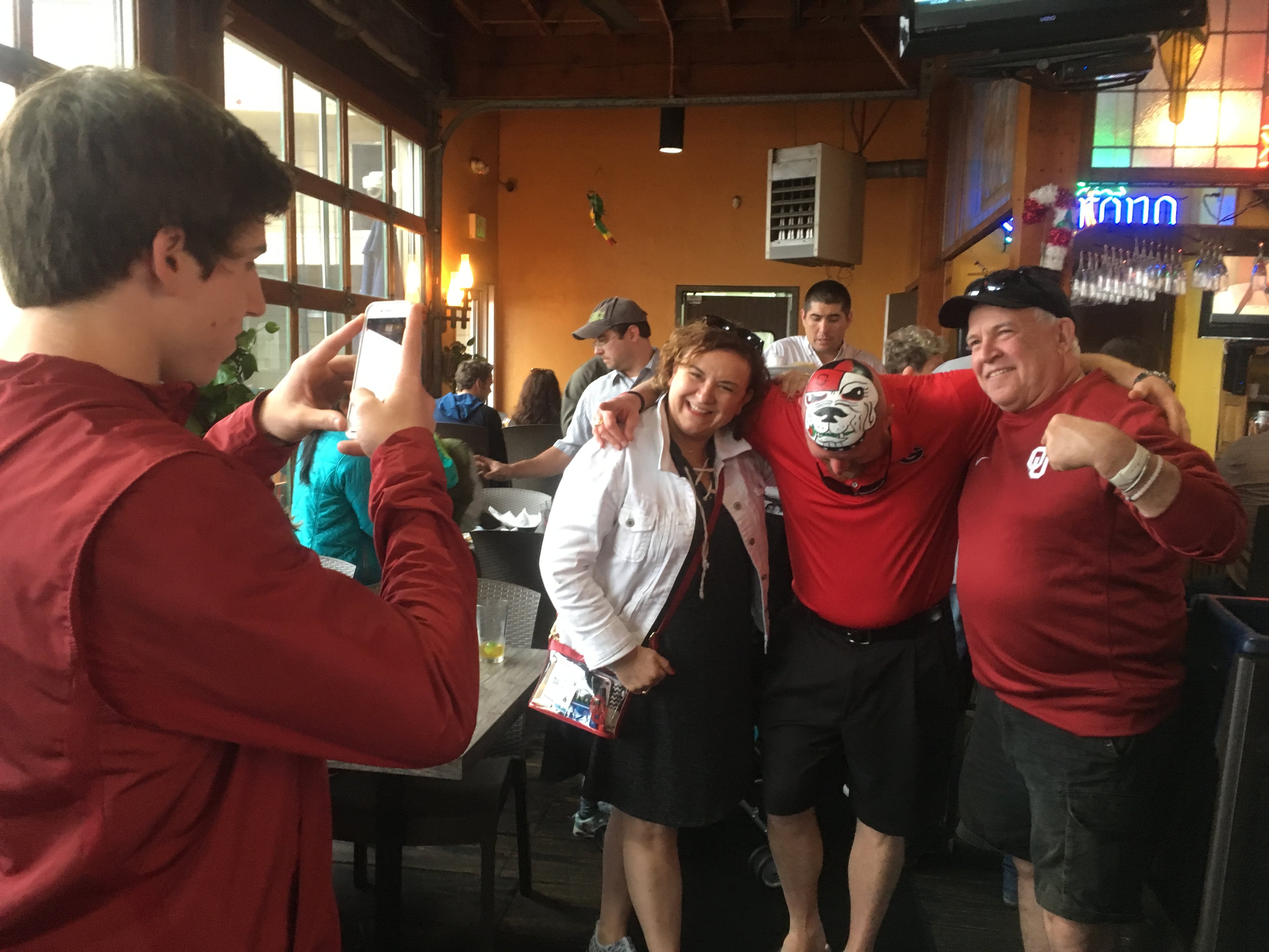 December 2017 file photo: These folks are Oklahoma fans but they all wanted photos with Trent "Big Dawg III" Woods. Photo: Jennifer Brett