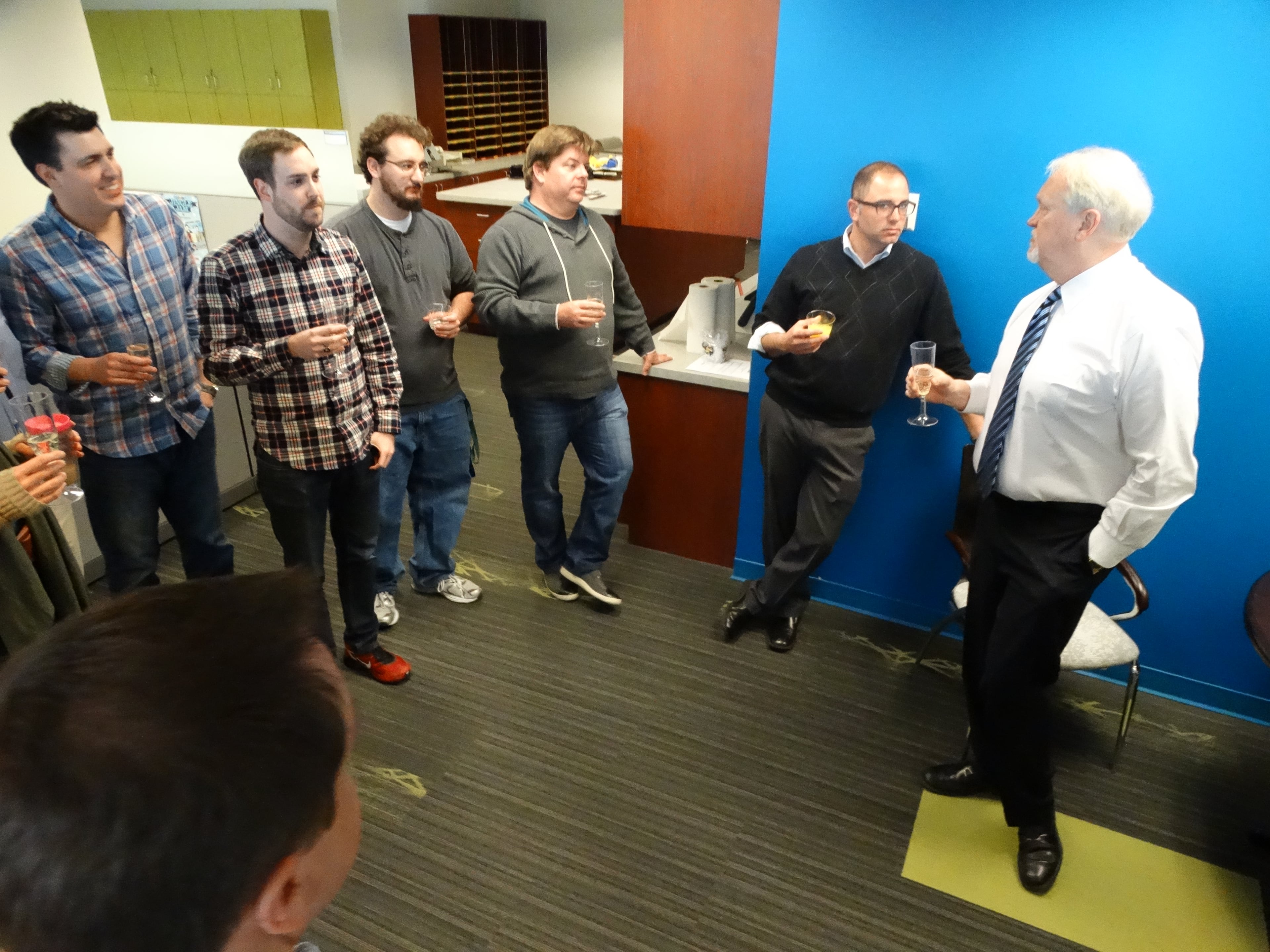 Mike Fowler gives the Star 94 crew a pep talk after the first Jeff and Jenn show. CREDIT: Rodney Ho/ rho@ajc.com