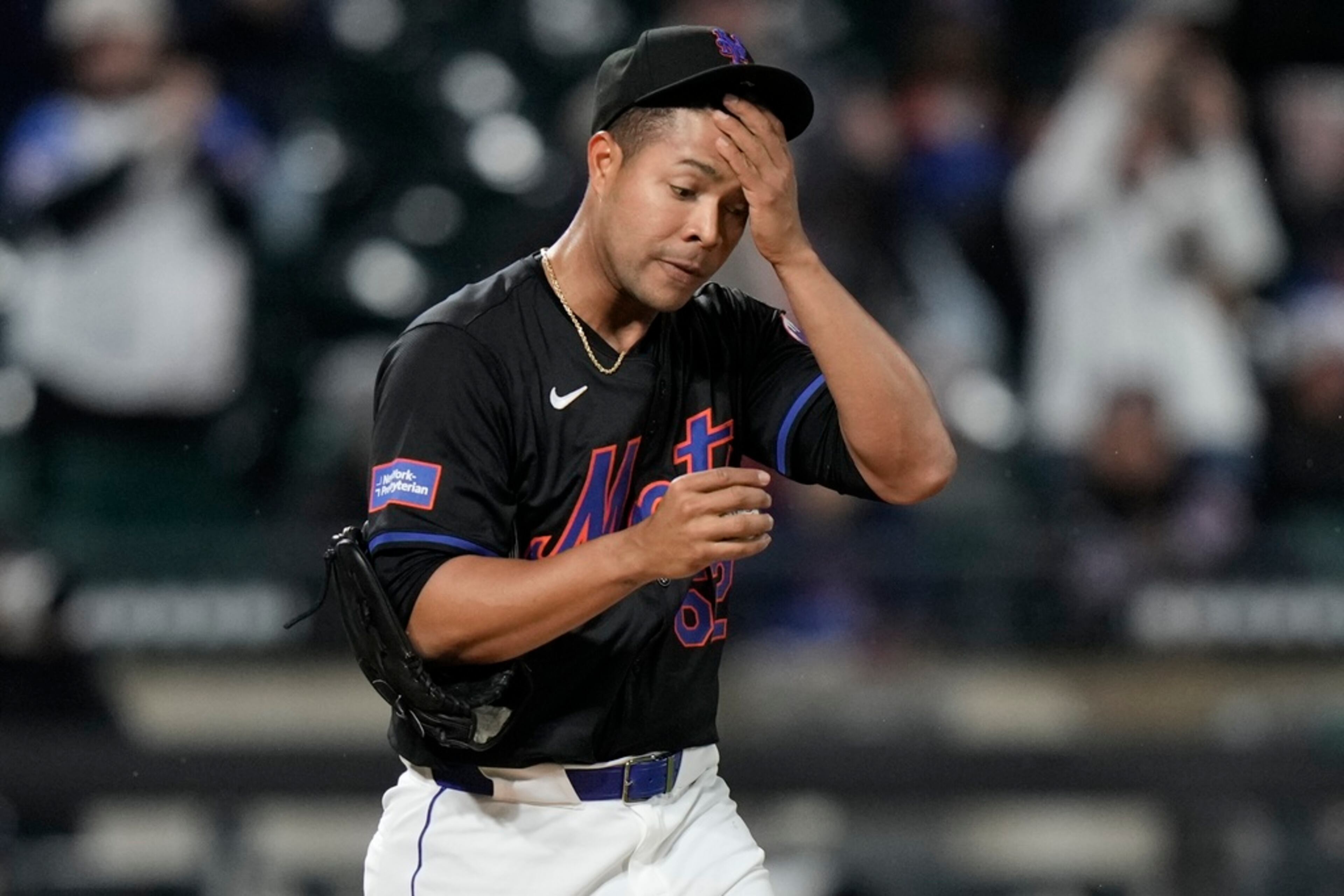 New York Mets pitcher Jose Quintana reacts as Atlanta Braves' Ozzie Albies runs the bases on a home run during the third inning of a baseball game Friday, May 10, 2024, in New York. (AP Photo/Frank Franklin II)