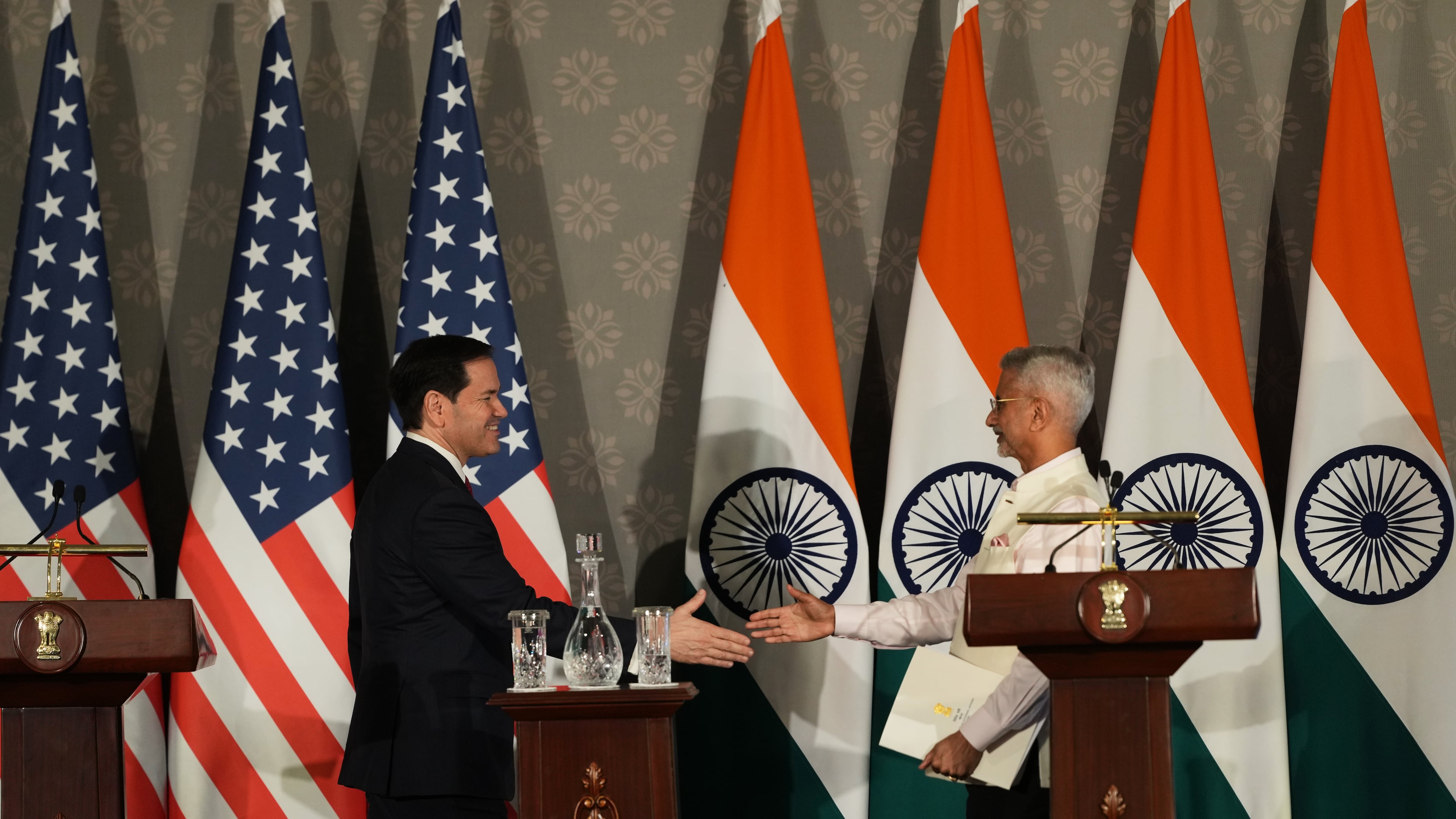 United States Secretary of State Marco Rubio, left, walks to shake hands with India's Minister of External Affairs S. Jaishankar after addressing a joint press conference following their talks in New Delhi, India, Sunday, May 24, 2026. (AP Photo/Manish Swarup)