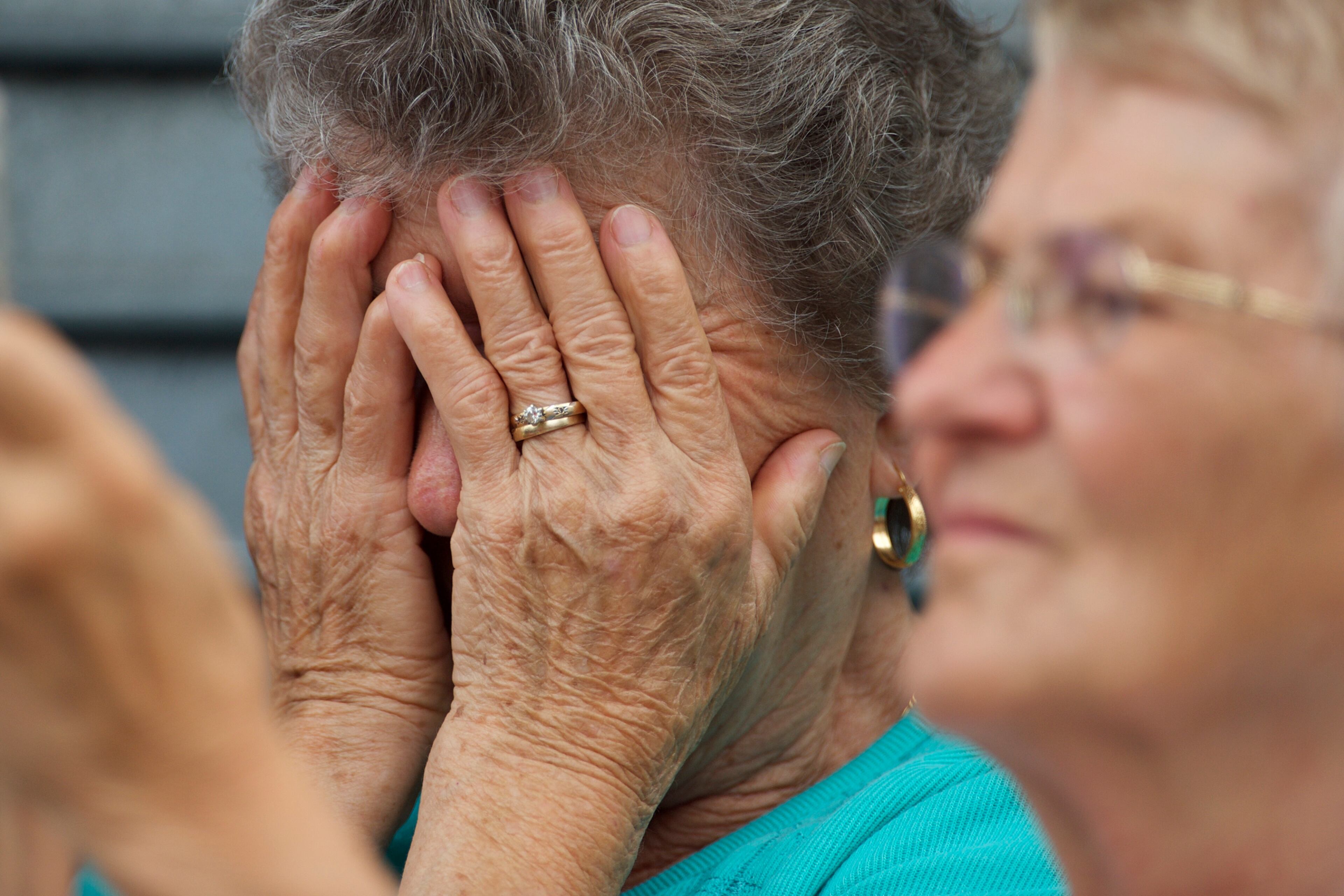 WILMINGTON, DE - JUNE 6: A woman reacts as the hearse and Biden family arrives for a mass of Christian burial at St. Anthony of Padua Church for former Delaware Attorney General Beau Biden, on June 6, 2015 in Wilmington, Delaware. U.S. President Barack Obama is expected to deliver a eulogy for the son of Vice President Joe Biden after he died at 46 following a two-year battle with brain cancer. (Photo by Mark Makela/Getty Images)