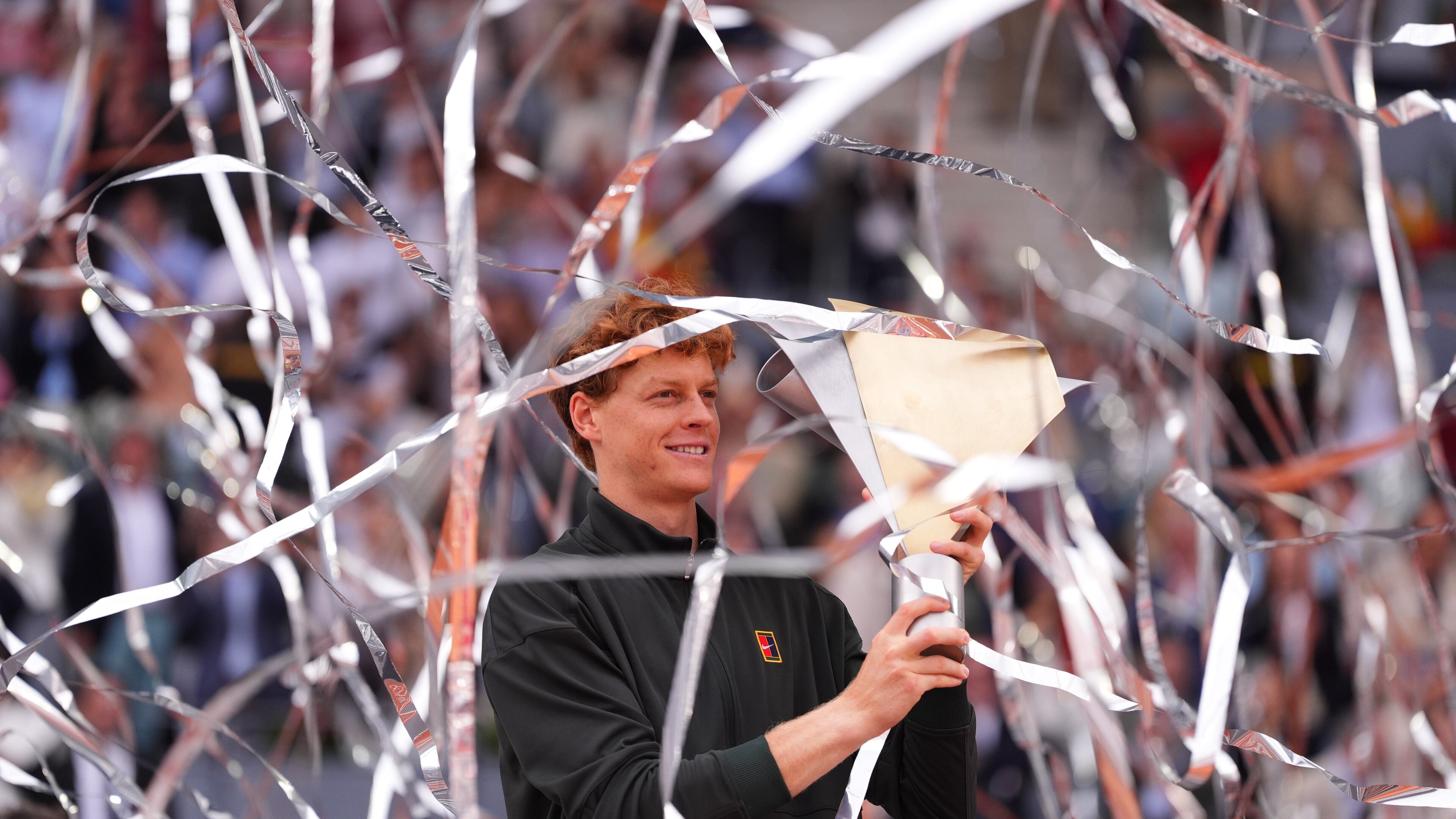 Jannik Sinner, of Italy, holds the trophy after winning the men's singles tennis final match against Alexander Zverev, of Germany, at the Madrid Open tennis tournament in Madrid, Spain, Sunday, May 3, 2026. (AP Photo/Manu Fernandez)