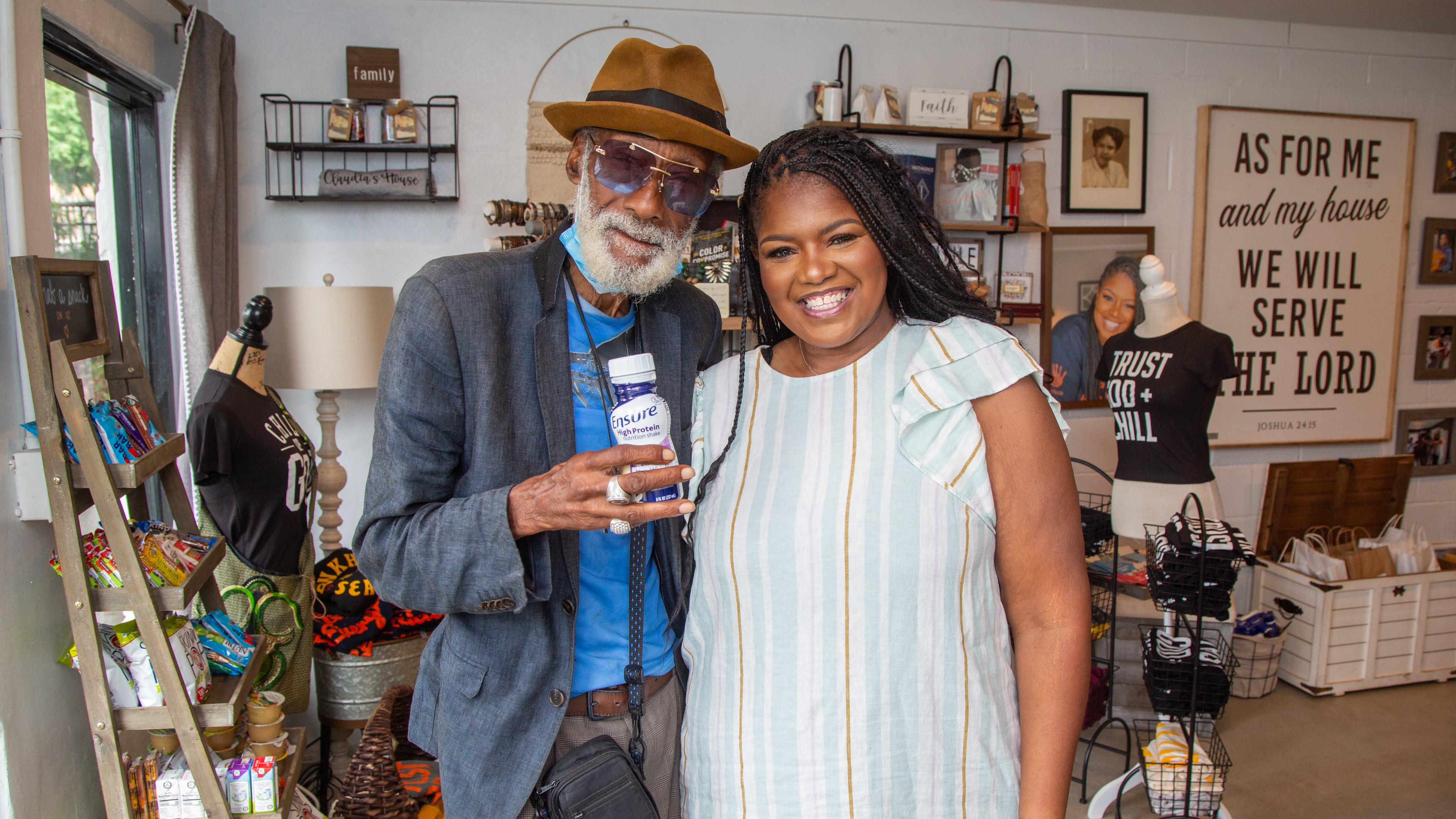 Customer Hershel Hamilton (left) stands with LaTonya Gates in the PAWkids food pantry and store in Grove Park on the Westside of Atlanta. PHIL SKINNER FOR THE ATLANTA JOURNAL-CONSTITUTION.