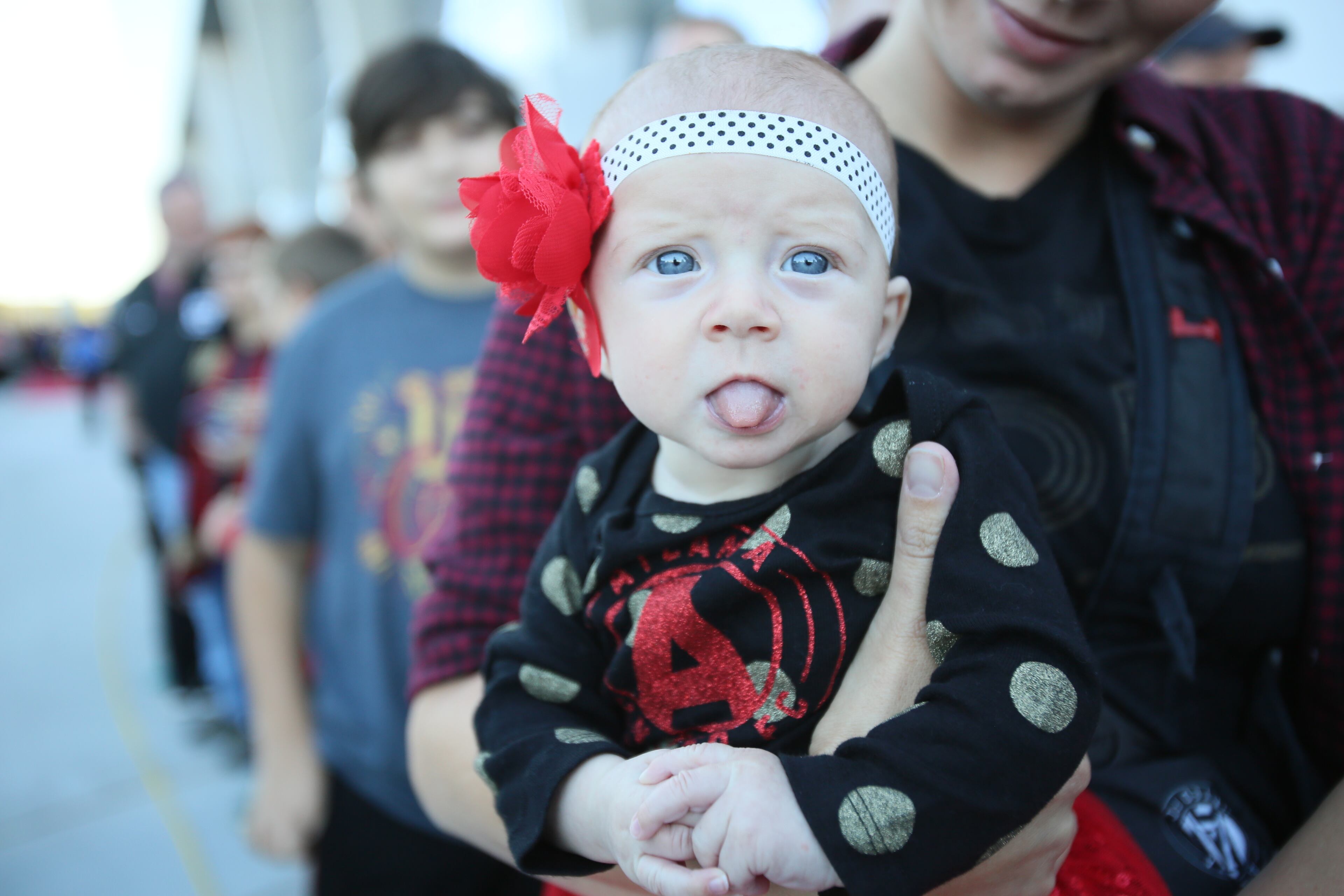 Caitlynn Stille wears a Atlanta United jersey. She's at the game with her mom Ashley Stille.