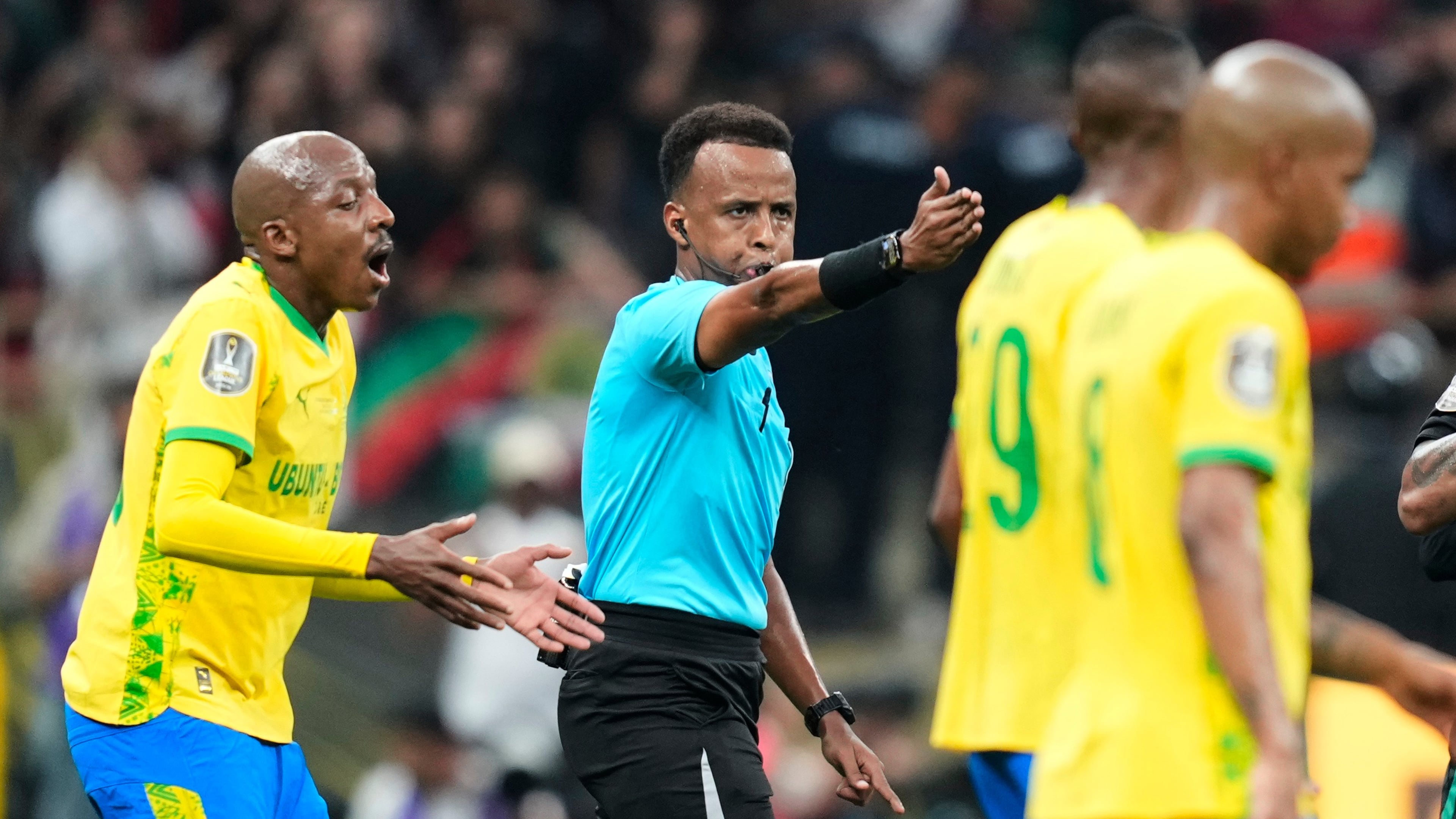 FILE - Referee Omar Artan, center, signals a penalty during the CAF Champions League final soccer match between AS FAR Rabat and Mamelodi Sundowns, in Rabat, Morocco, Sunday, May 24, 2026. (AP Photo/Mosa'ab Elshamy, File)