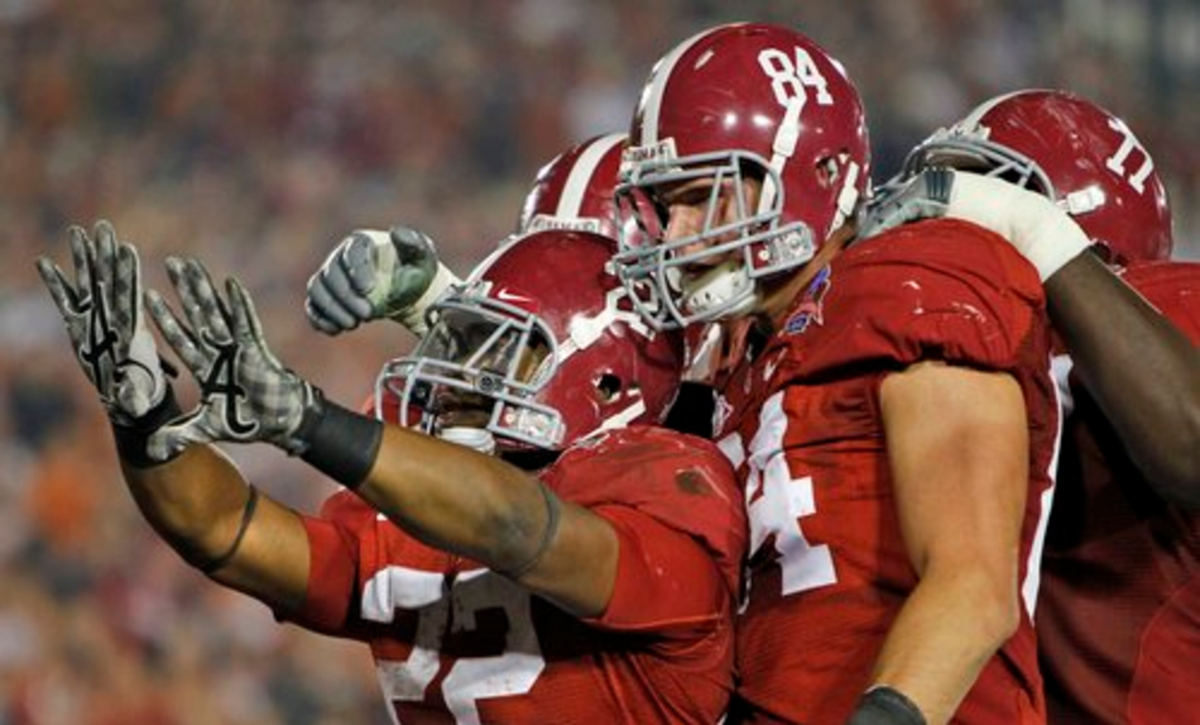 labama running back Mark Ingram (22) is congratulated by his teammates after scoring a touchdown.