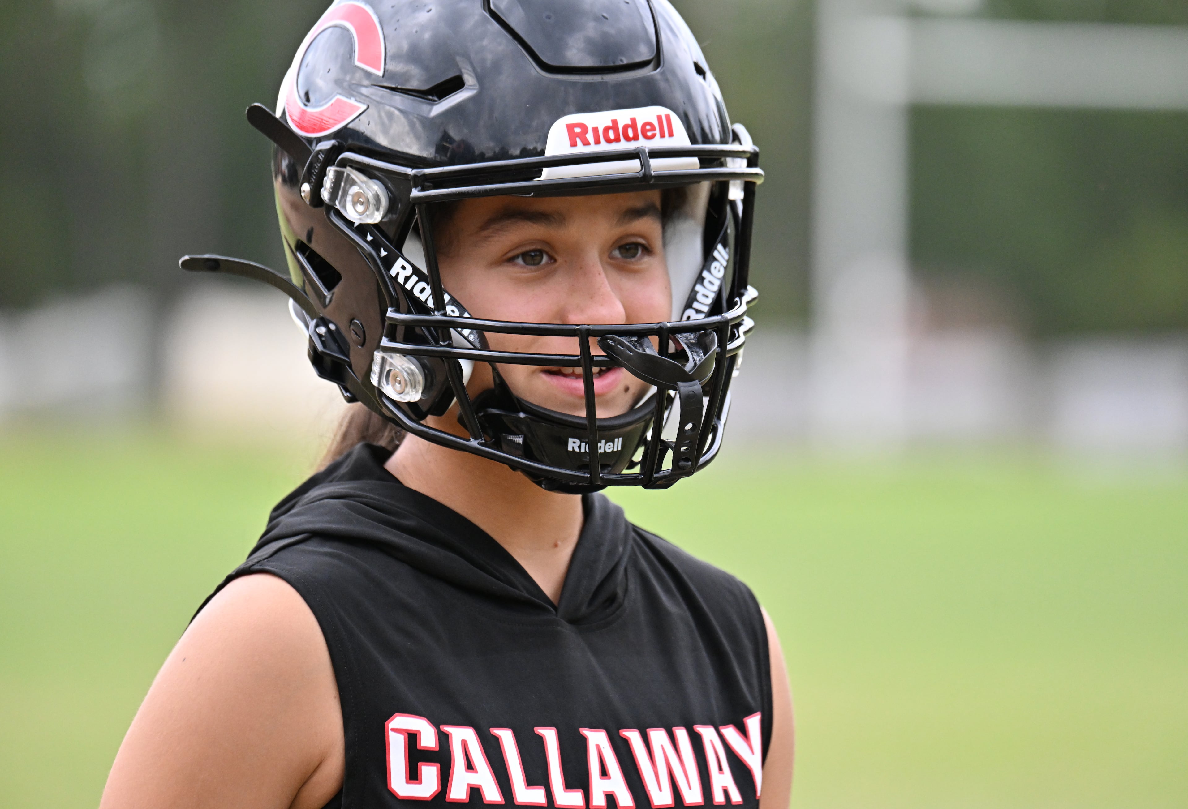 Mia Flores, who is the first female football player in Callaway High’s history, smiles during practice on Thursday, Sept. 25, 2025, in Hogansville. (Hyosub Shin/AJC)
