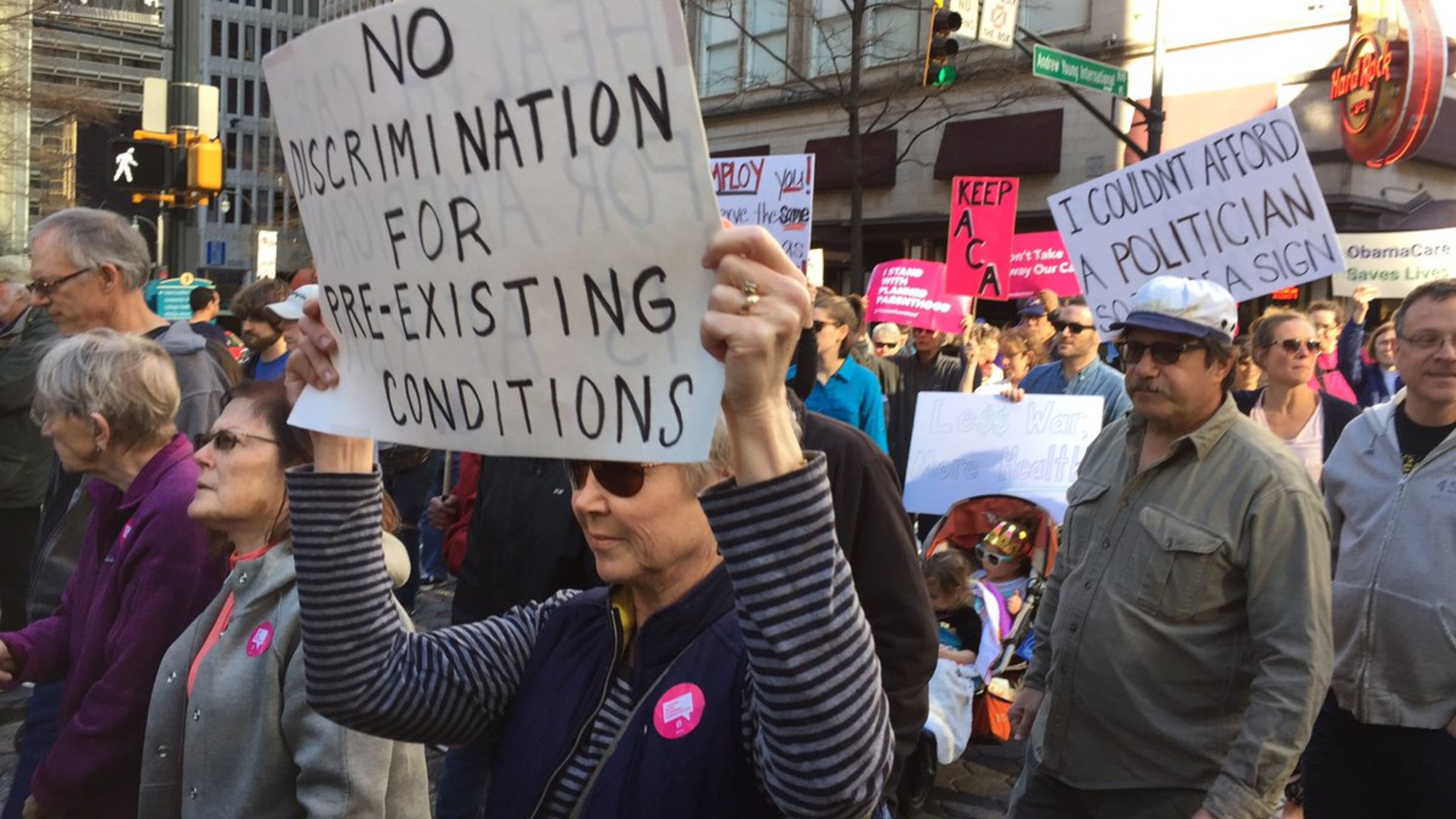 People marched Saturday in Atlanta in opposition to possible repeal of the Affordable Care Act. (Credit: Channel 2 Action News)
