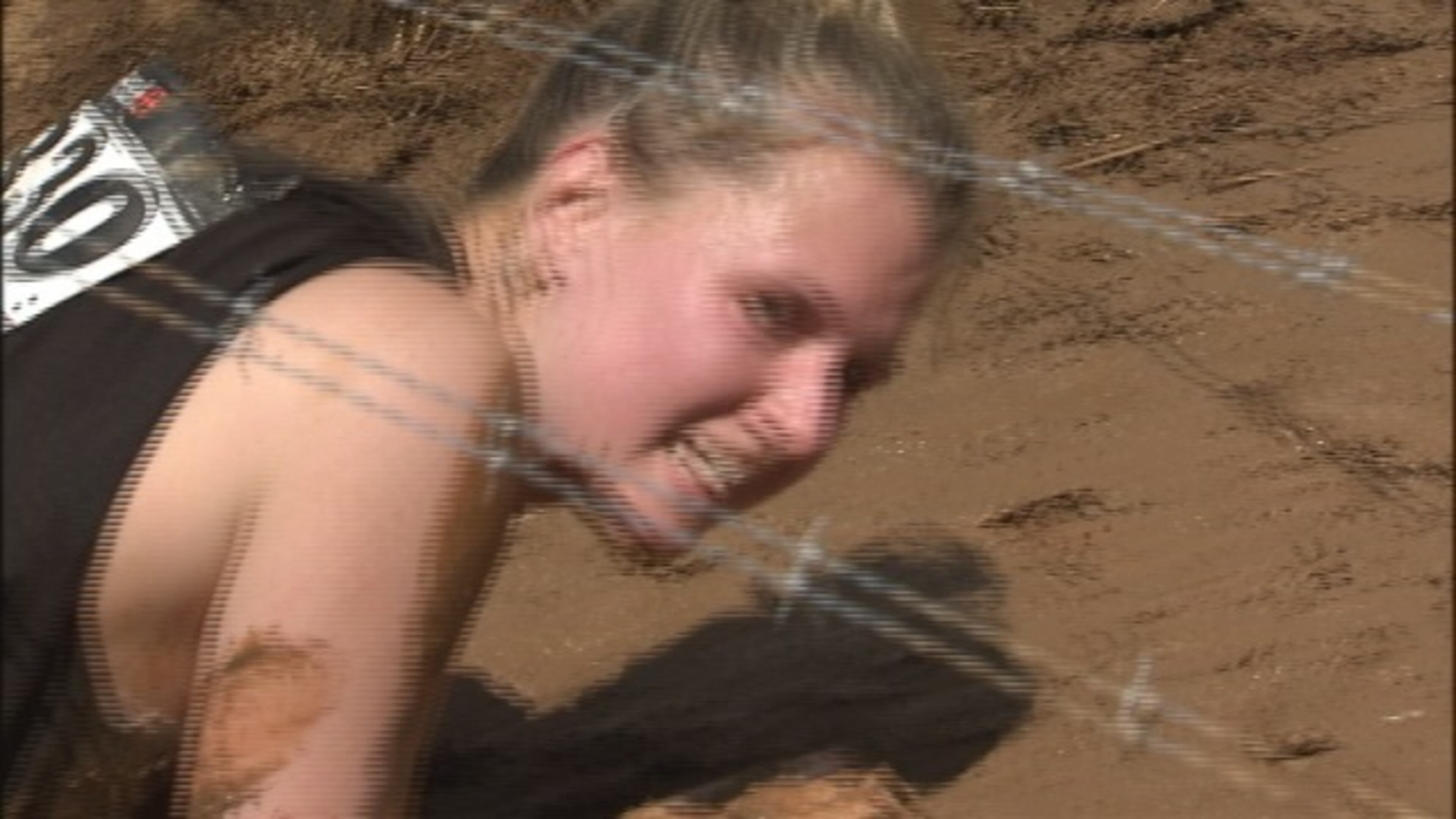 Runners battled mud, fire and barbed wire to compete in the Spartan Race at the National Whitewater Center in Charlotte.