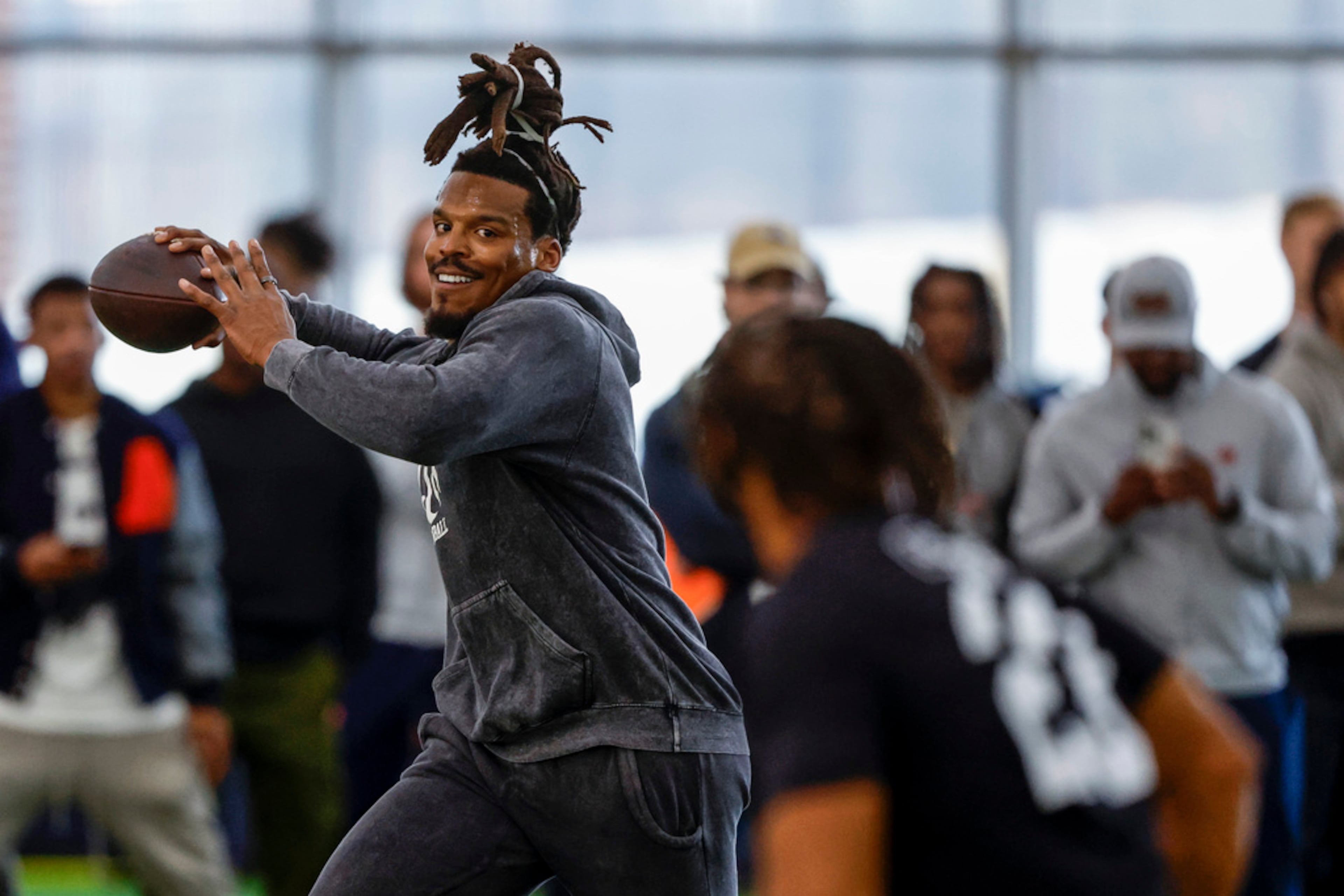 Former NFL and Auburn quarterback Cam Newton throws a pass during Auburn Pro Day on March 21, 2023, in Auburn, Ala. (Butch Dill/AP)