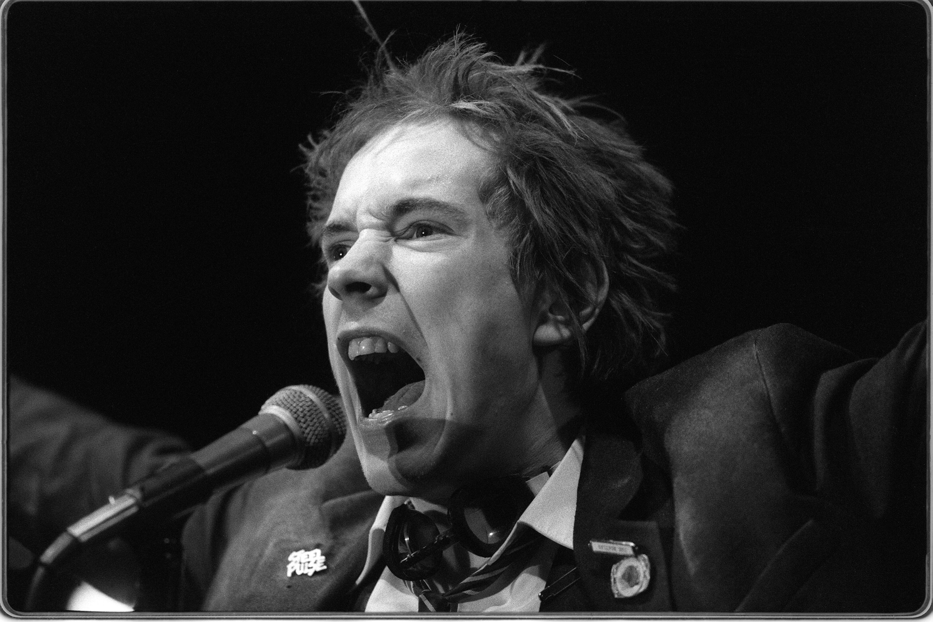 Johnny Rotten of The Sex Pistols during their concert at The Great Southeast Music Hall on January 5, 1978. This was their first American concert. (LOUIE FAVORITE / STAFF)
