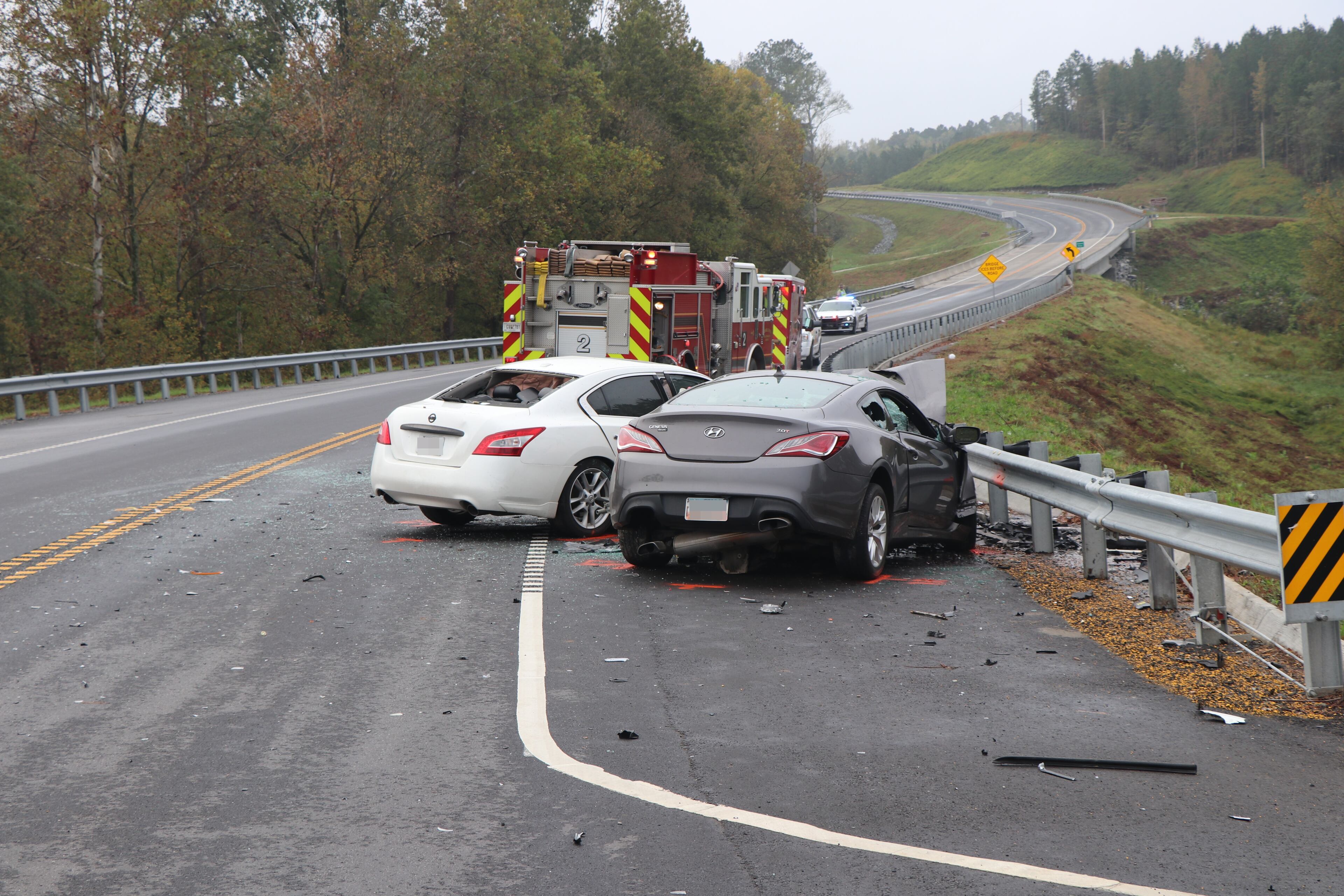 The driver of a Nissan Maxima was passing a tractor-trailer and collided with an eastbound Hyundai Genesis. Both drivers were killed.