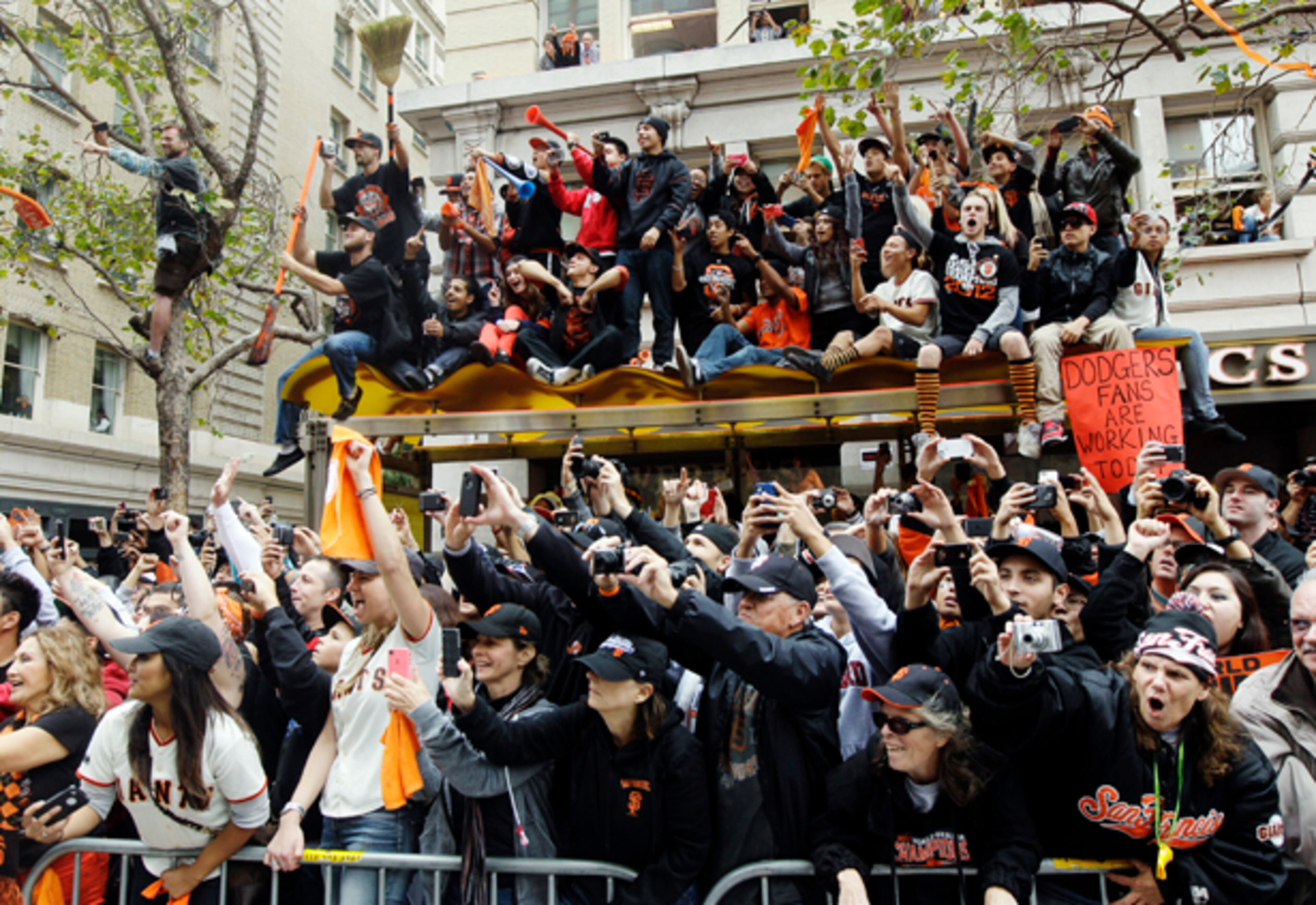 San Francisco Giants fans cheer during the baseball team's World Series victory parade, Wednesday, Oct. 31, 2012, in San Francisco. (AP Photo/Jeff Chiu)