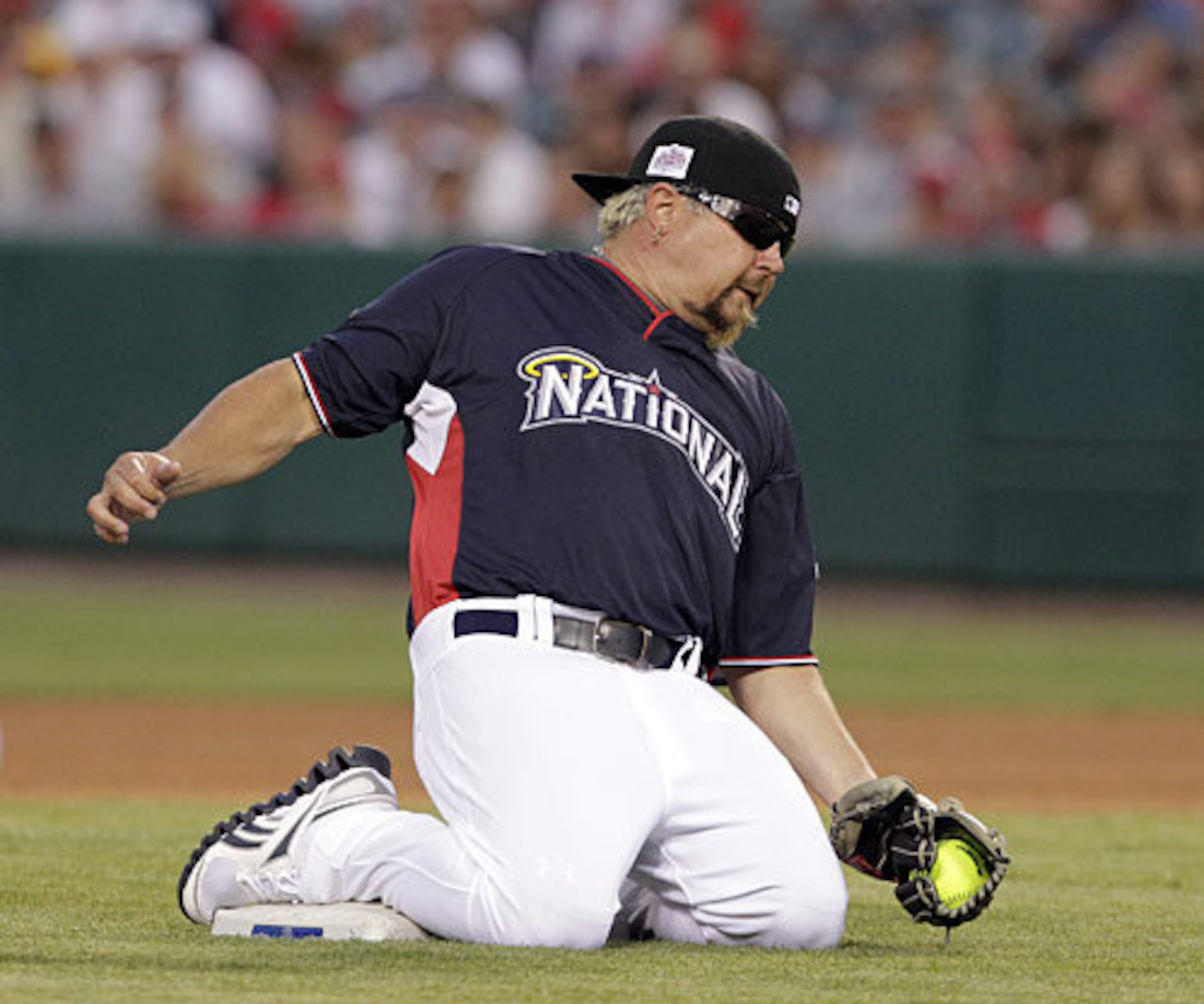 Celebrity chef Guy Fieri drops to his knees to make a -- no pun intended -- "snow-cone" catch.