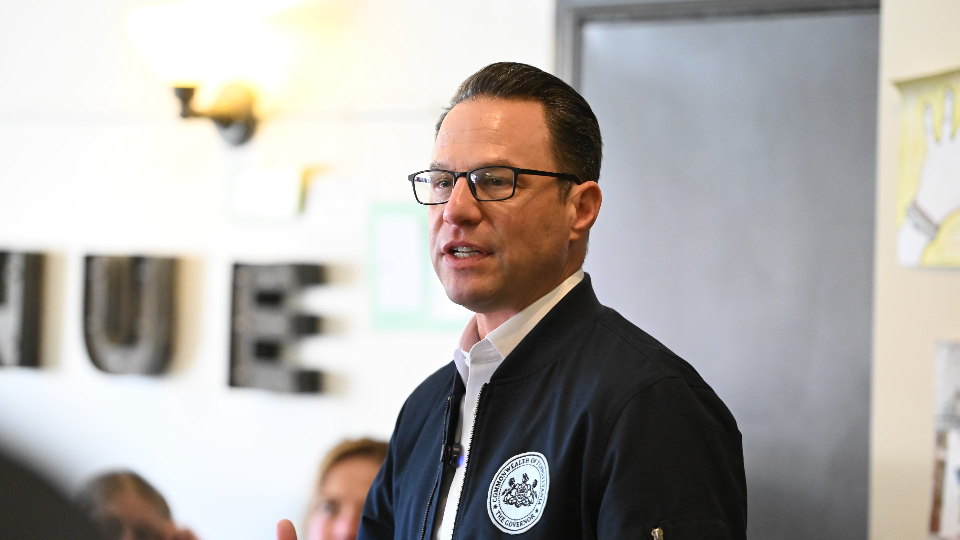 FILE - Pennsylvania Gov. Josh Shapiro speaks to the crowd at a Clinton County Democratic Party event at the Avenue 209 coffee shop, April 11, 2026, in Lock Haven, Pa. (AP Photo/Marc Levy, File)