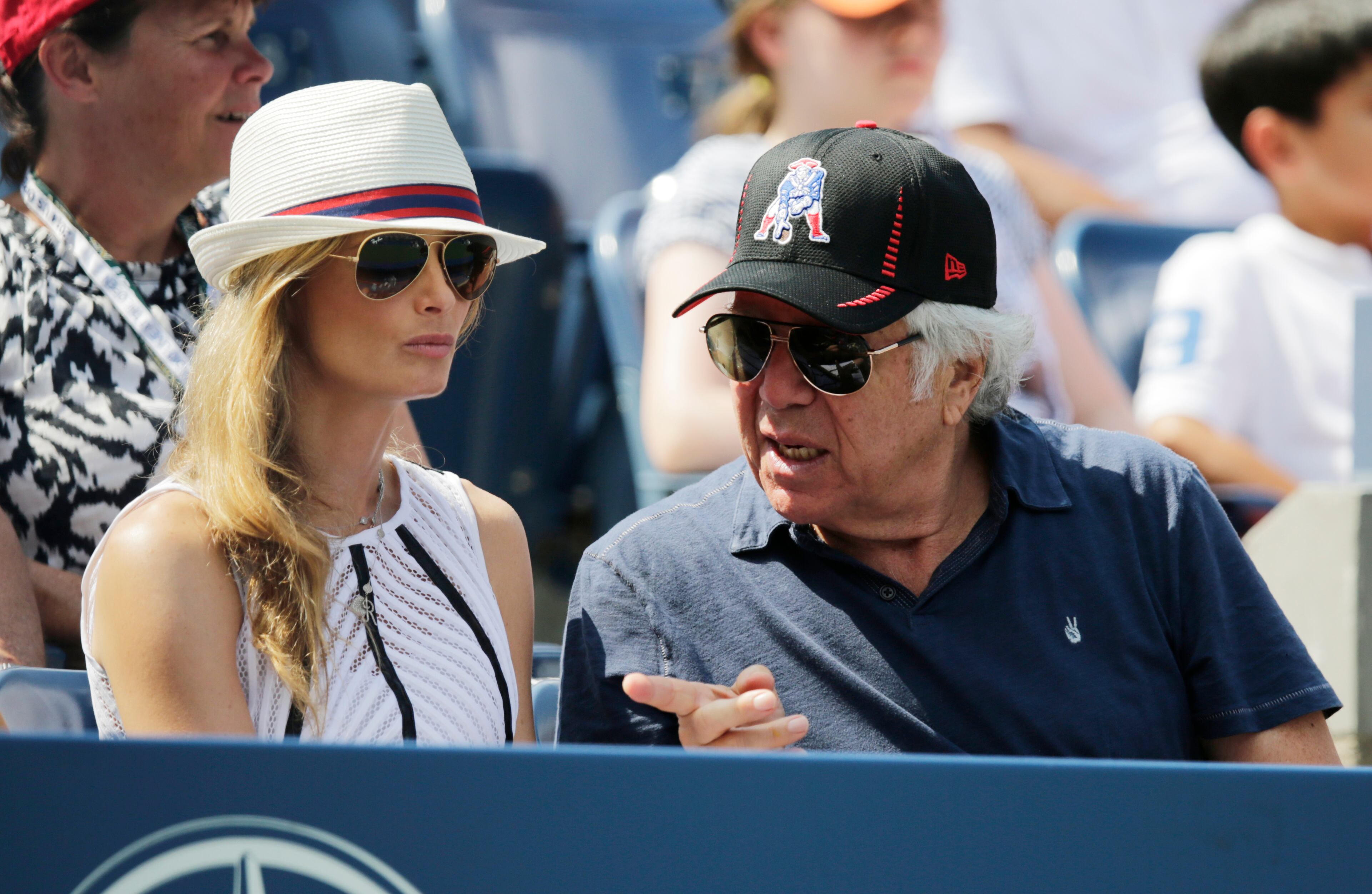 New England Patriots owner Robert Kraft, right, talks with his girlfriend Ricki Noel Lander while watching play between Kei Nishikori, of Japan, and Novak Djokovic, of Serbia, during the semifinals of the 2014 U.S. Open tennis tournament, Saturday, Sept. 6, 2014, in New York. (AP Photo/Charles Krupa)
