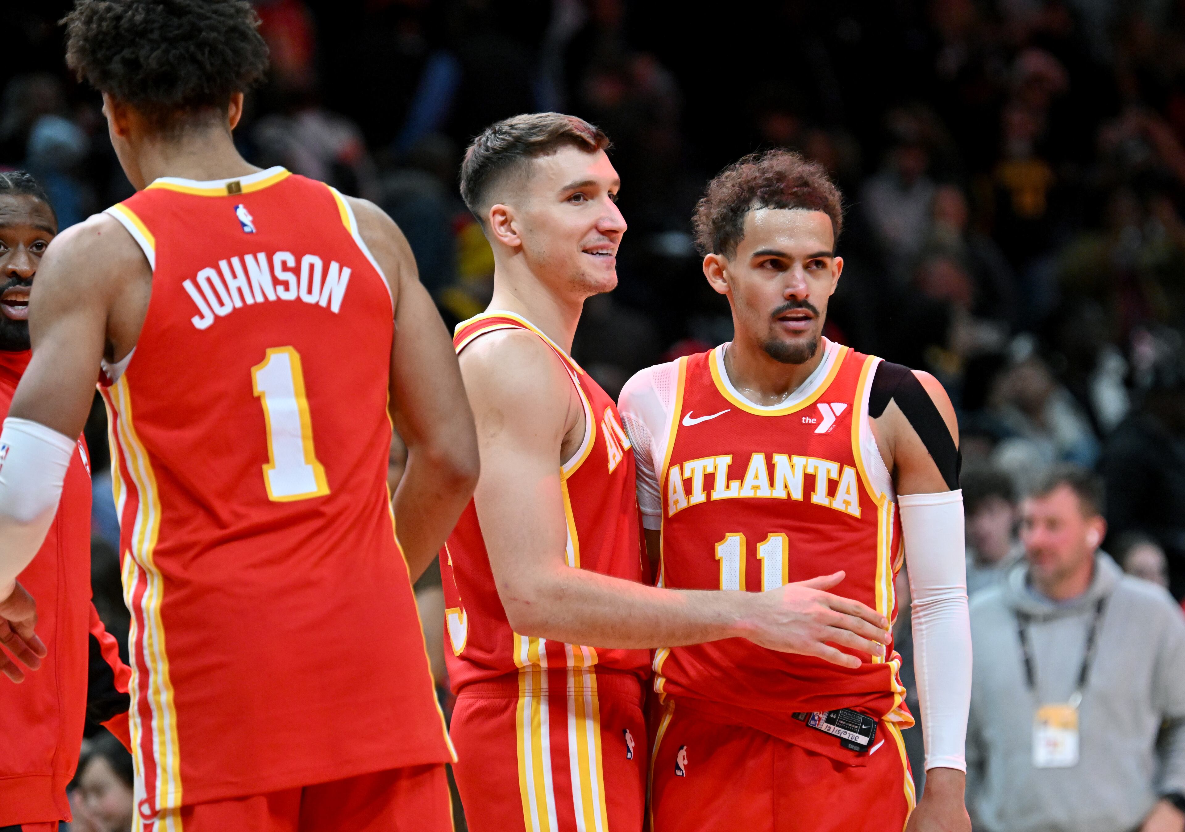 Atlanta Hawks guard Bogdan Bogdanovic (13) and Atlanta Hawks guard Trae Young (11) celebrate after the win. (Hyosub Shin / Hyosub.Shin@ajc.com)