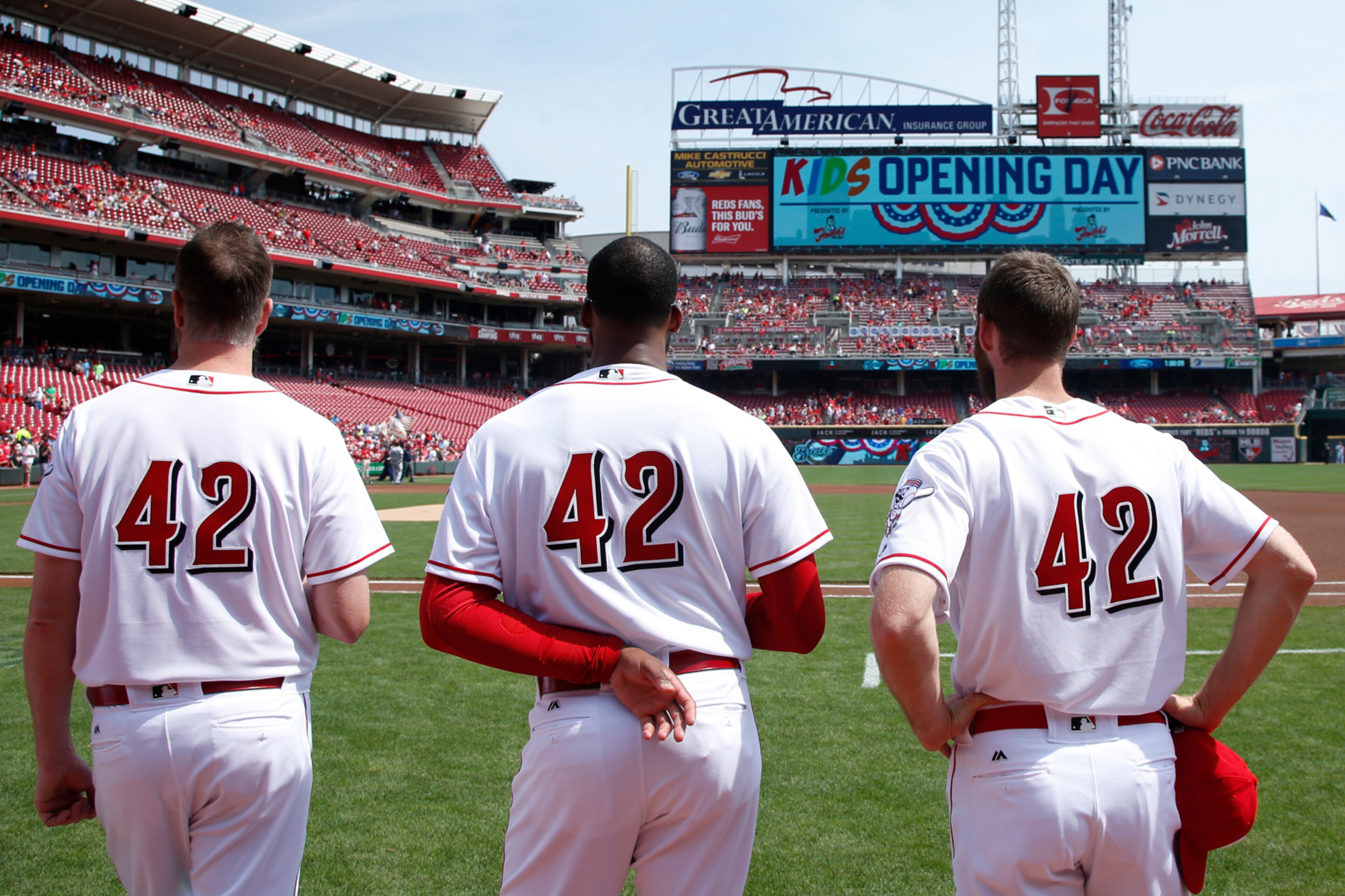 CINCINNATI, OH - APRIL 15: Cincinnati Reds players wear No. 42 in honor of Jackie Robinson Day as they stand for the national anthem prior to a game against the Milwaukee Brewers at Great American Ball Park on April 15, 2017 in Cincinnati, Ohio. (Photo by Joe Robbins/Getty Images) *** BESTPIX ***