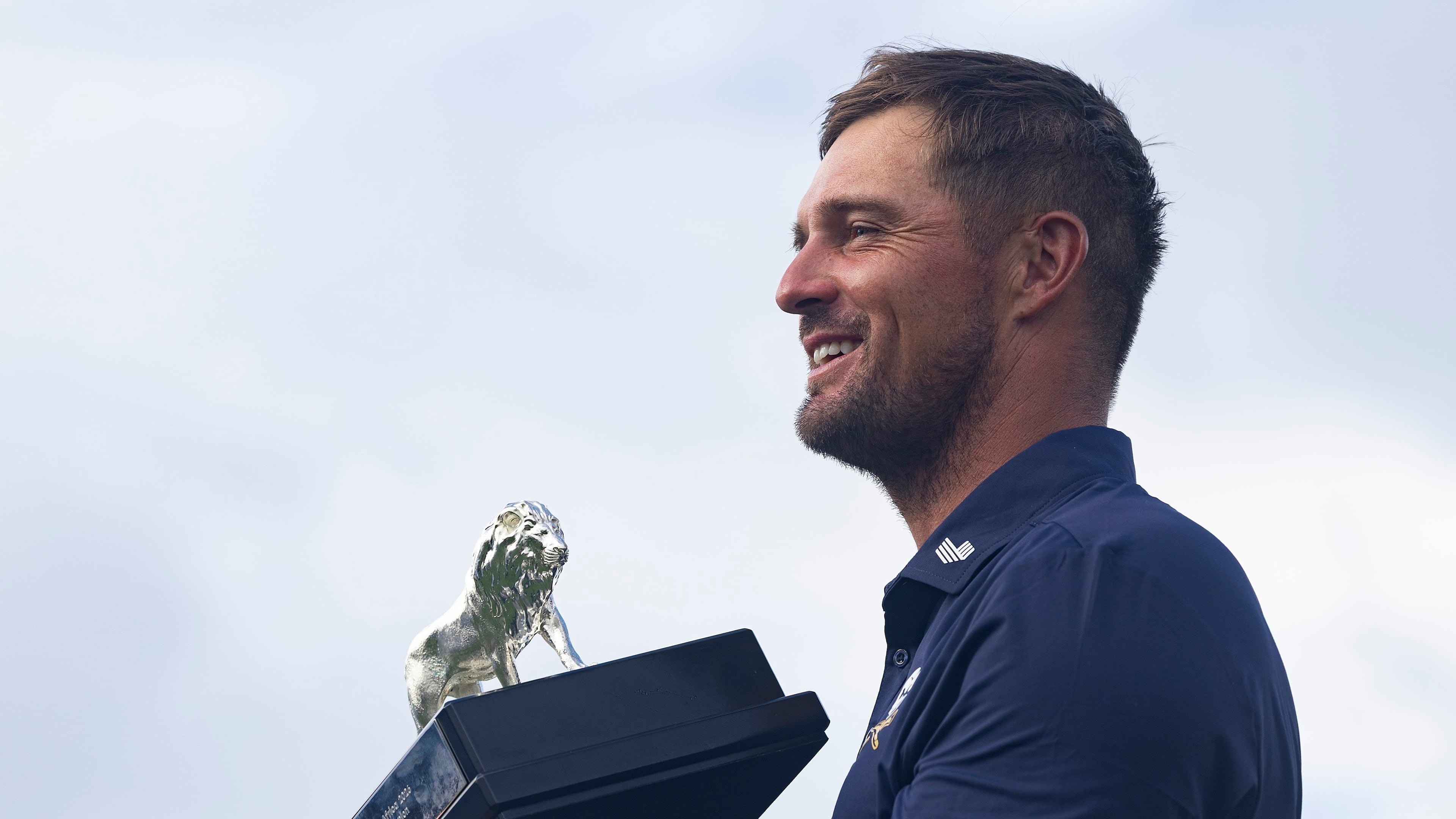 First-place individual champion, captain Bryson DeChambeau, of Crushers GC, poses for a photo with the trophy after the final round of LIV Golf South Africa at The Club at Steyn City, Sunday, March 22, 2026, in Midrand, South Africa. (LIV Golf via AP)