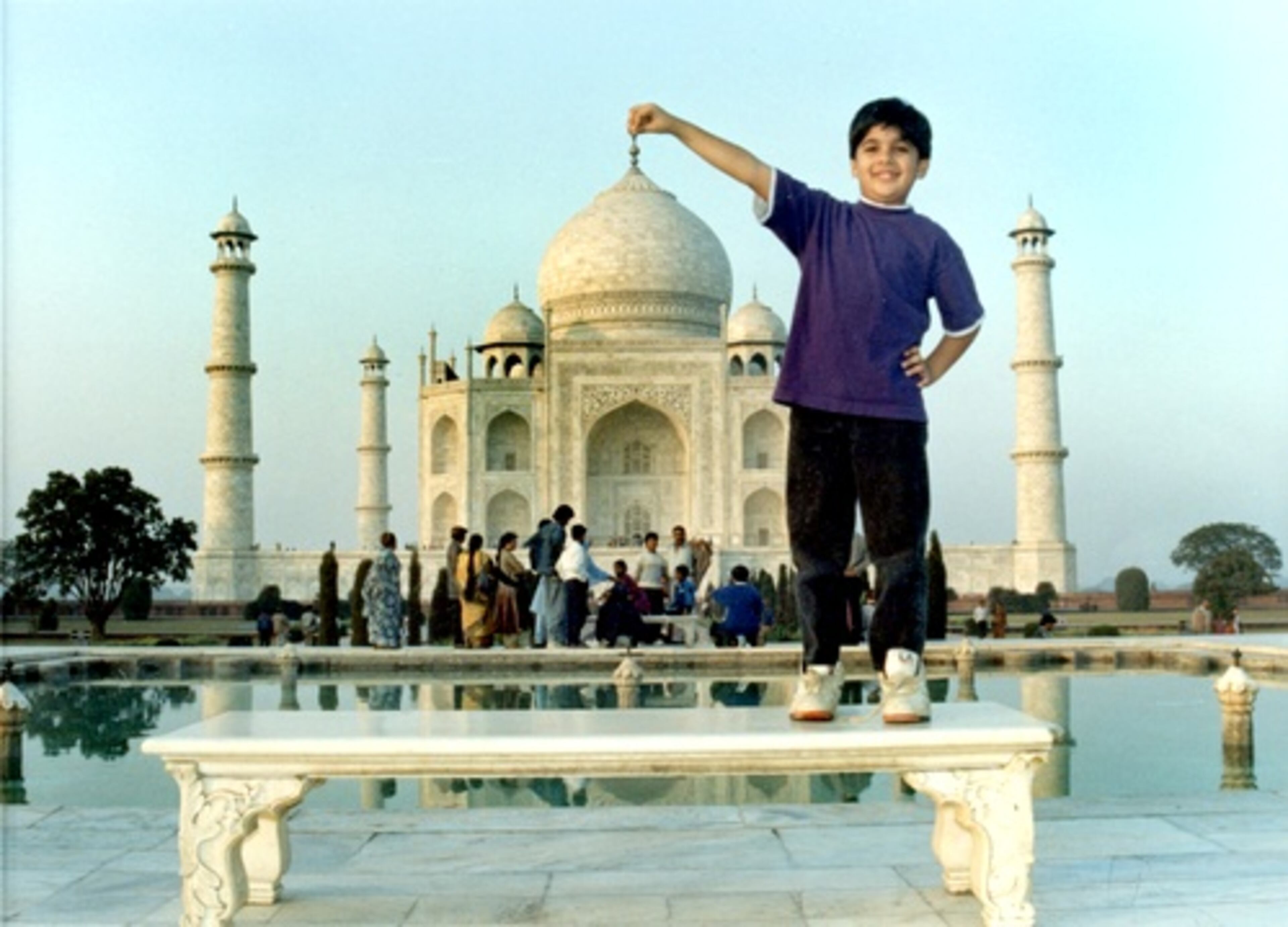 "I'm fortunate to always be surrounded by people both at home and at school who are equally if not more gifted than me in every way," said Deep Shah, now 22. In this photo of him as boy, he poses in front of the Taj Mahal in India.