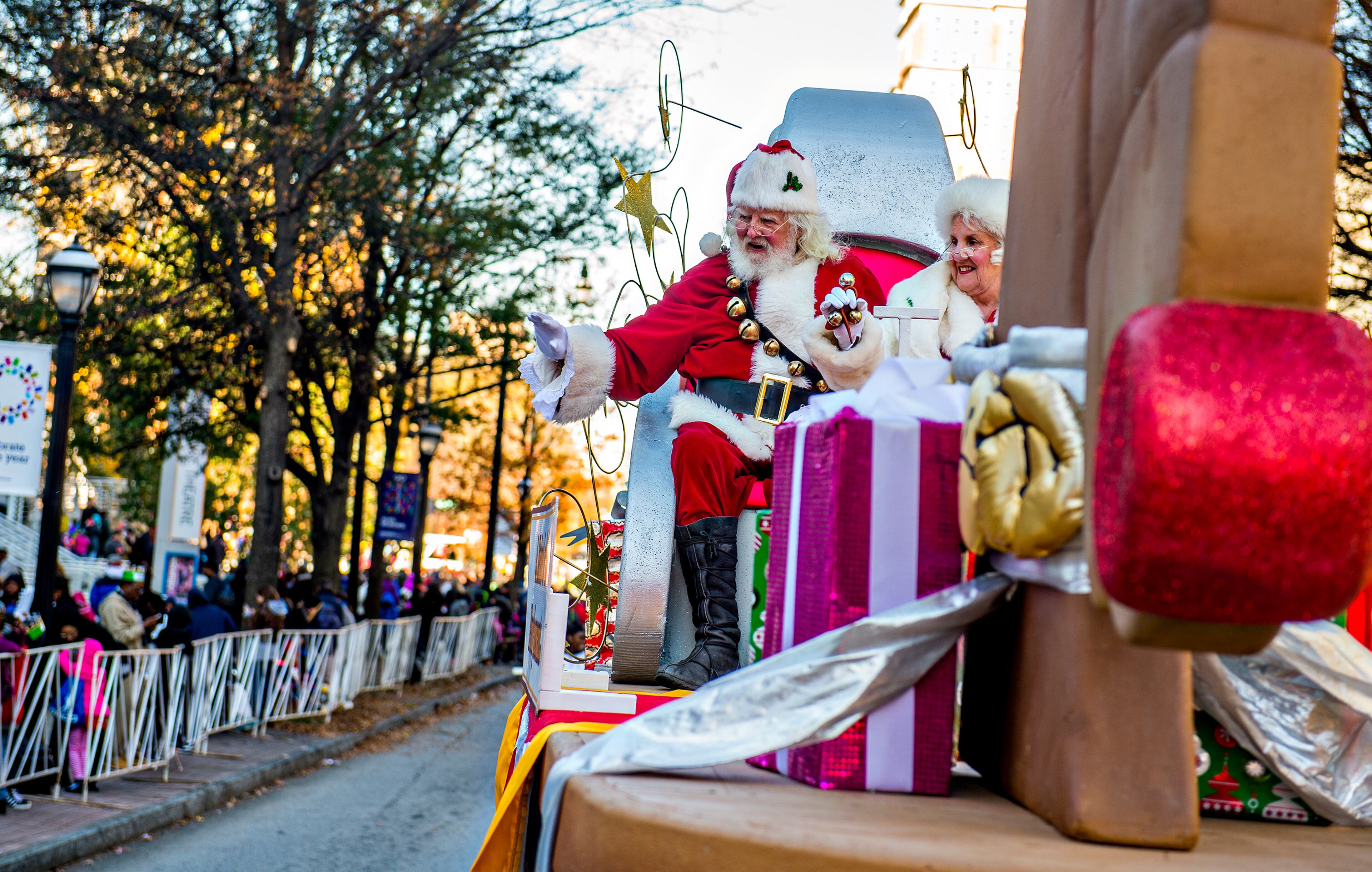 December 5, 2015 Atlanta - Santa and Mrs. Claus wave from atop their float during the 2015 Children's Christmas Parade in Atlanta on Saturday, December 5, 2015. Thousands gathered along Peachtree St. to watch the parade pass with marching bands, balloons, performances and more. JONATHAN PHILLIPS / SPECIAL