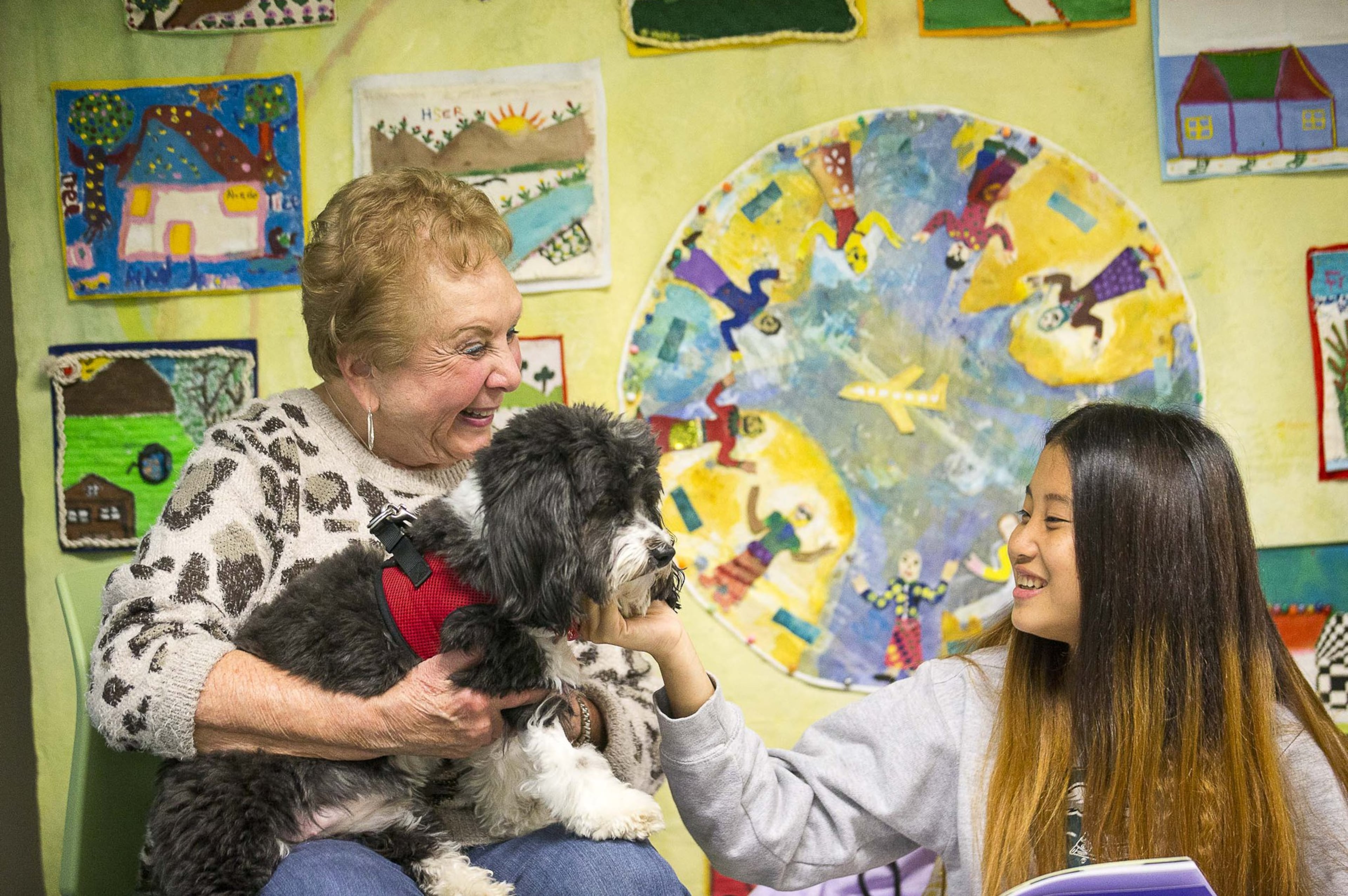 Lily Tova the therapy dog comforts refugee girls in Decatur