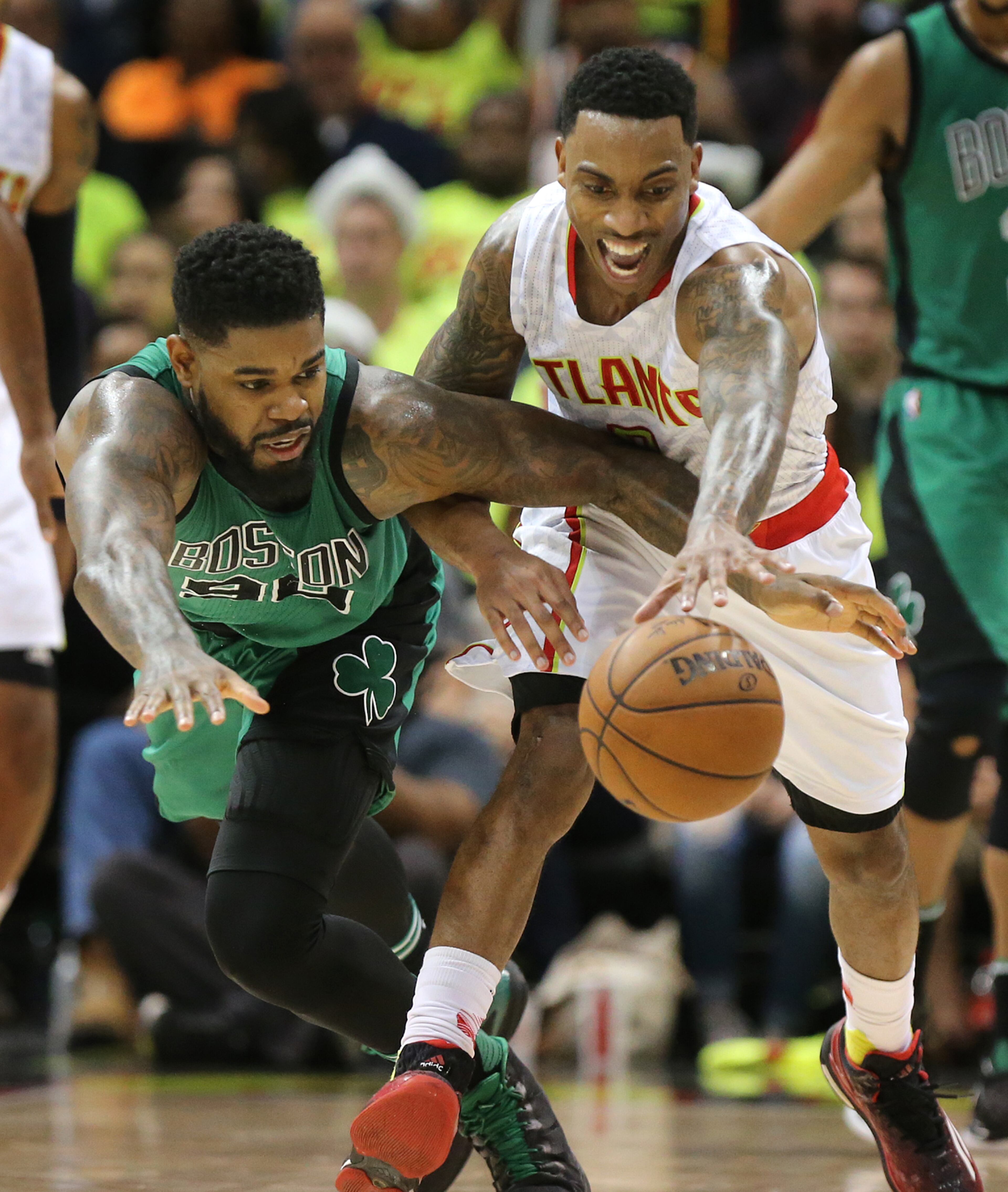 041616 ATLANTA: Hawks guard Jeff Teague steals from Amir Johnson on the way to beating the Celtics 102-101 in game one of their NBA Eastern Conference first round playoff game at Philips Arena on Saturday, April 16, 2016. Curtis Compton / ccompton@ajc.com