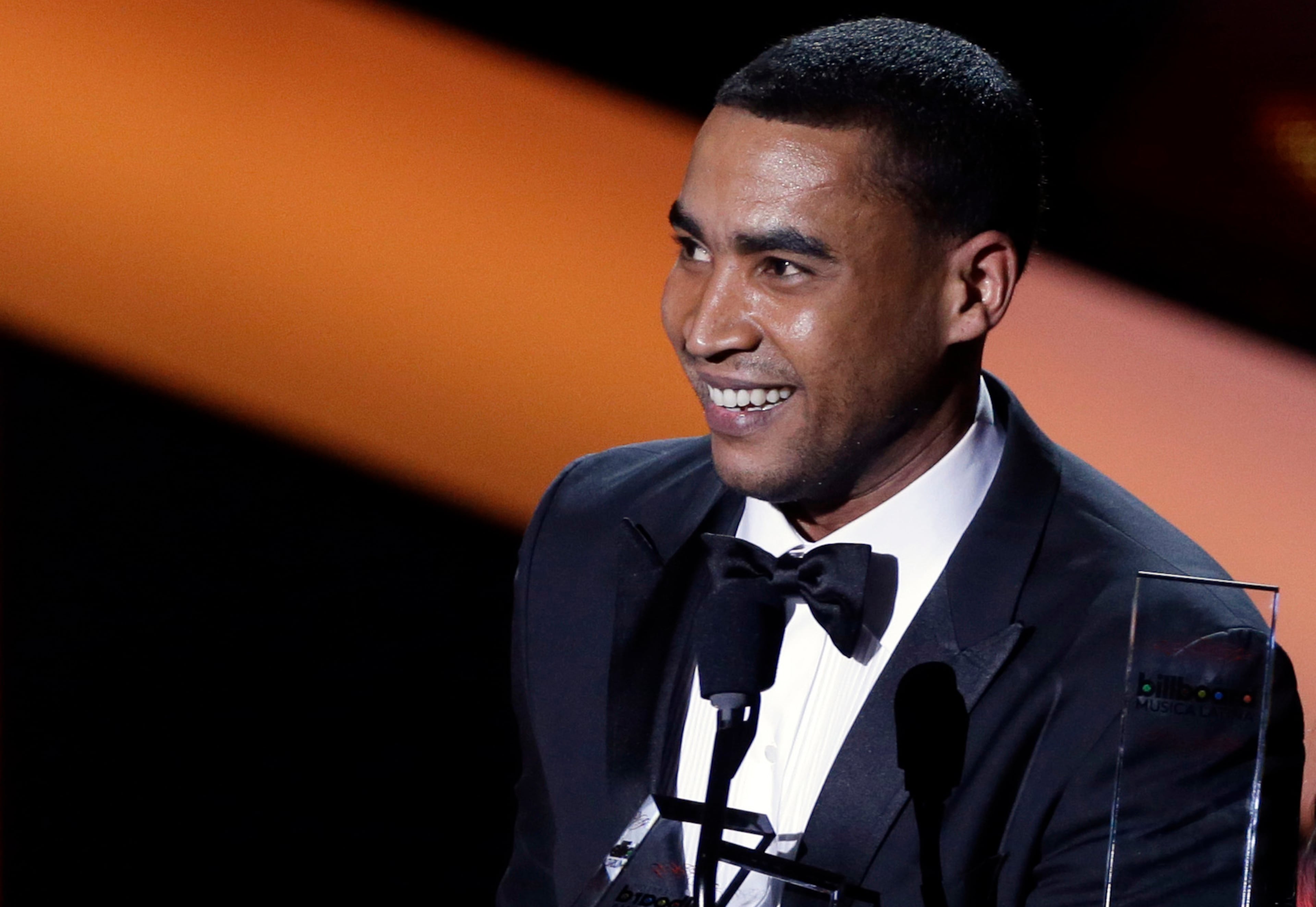 FILE - In this April 25, 2013 file photo, Don Omar attends the Latin Billboard Awards in Coral Gables, Fla. A Florida judge changed the bail conditions of the Puerto Rico reggaeton singer-rapper, who is under house arrest after he was accused of domestic violence against his ex-girlfriend. Omar, whose real name is William Omar Landrón Rivera, is under electronic monitoring and will be allowed to leave his home six days a week, for work. Don Omar won 10 awards last year at the Billboard Latin Music Awards. He also has appeared in several movies, including "Fast & Furious" in 2009. (AP Photo/Alan Diaz, File)