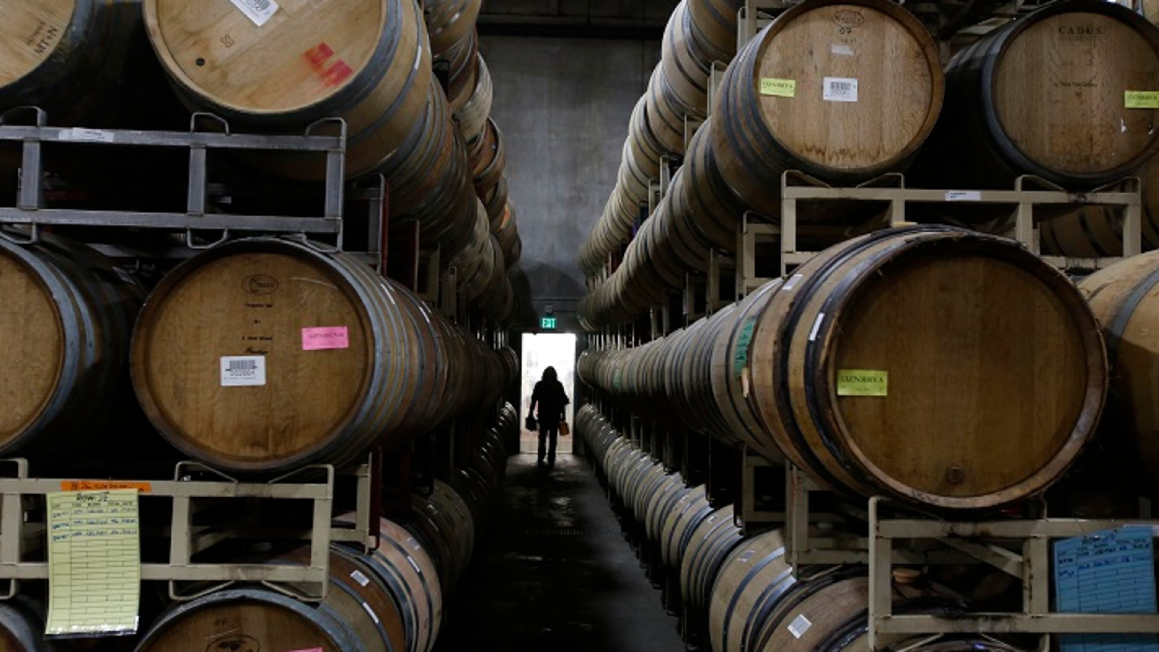 Oak barrels line the barrelhouse at the winery on Dec. 5, 2014 at Francis Ford Coppola Winery in Geyserville, Calif. Many winemakers, such as the Francis Ford Coppola Winery in Sonoma County, are helping with a massive ad campaign championing the benefits of using real cork on wine bottles. (Michael Robinson Chavez/Los Angeles Times/TNS)