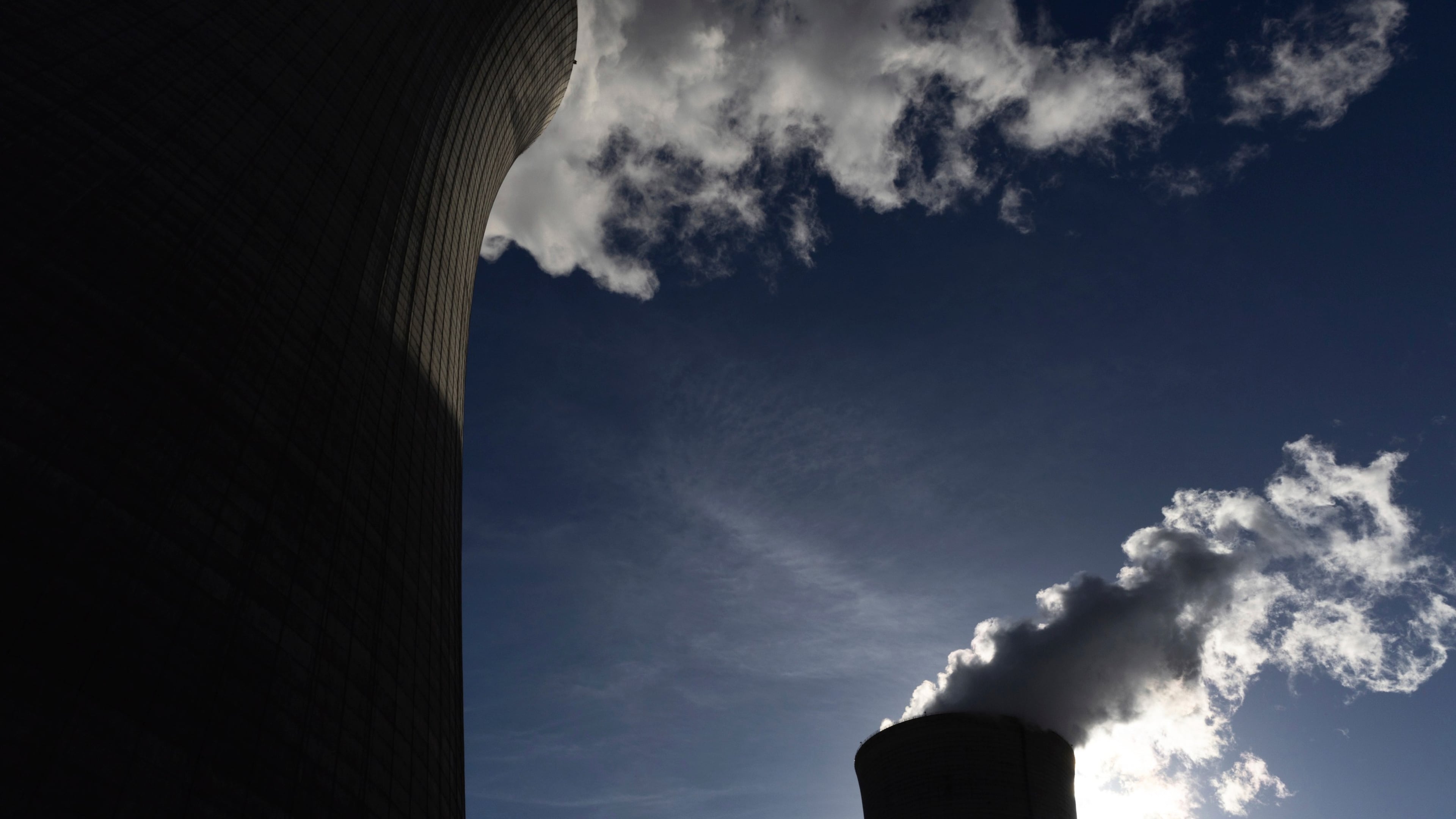 FILE - The cooling towers for units 4, left, and 3, right, are seen at Plant Vogtle, operated by Georgia Power Co., in east Georgia's Burke County near Waynesboro, Ga., on May 29, 2024. (Arvin Temkar/Atlanta Journal-Constitution via AP, File)