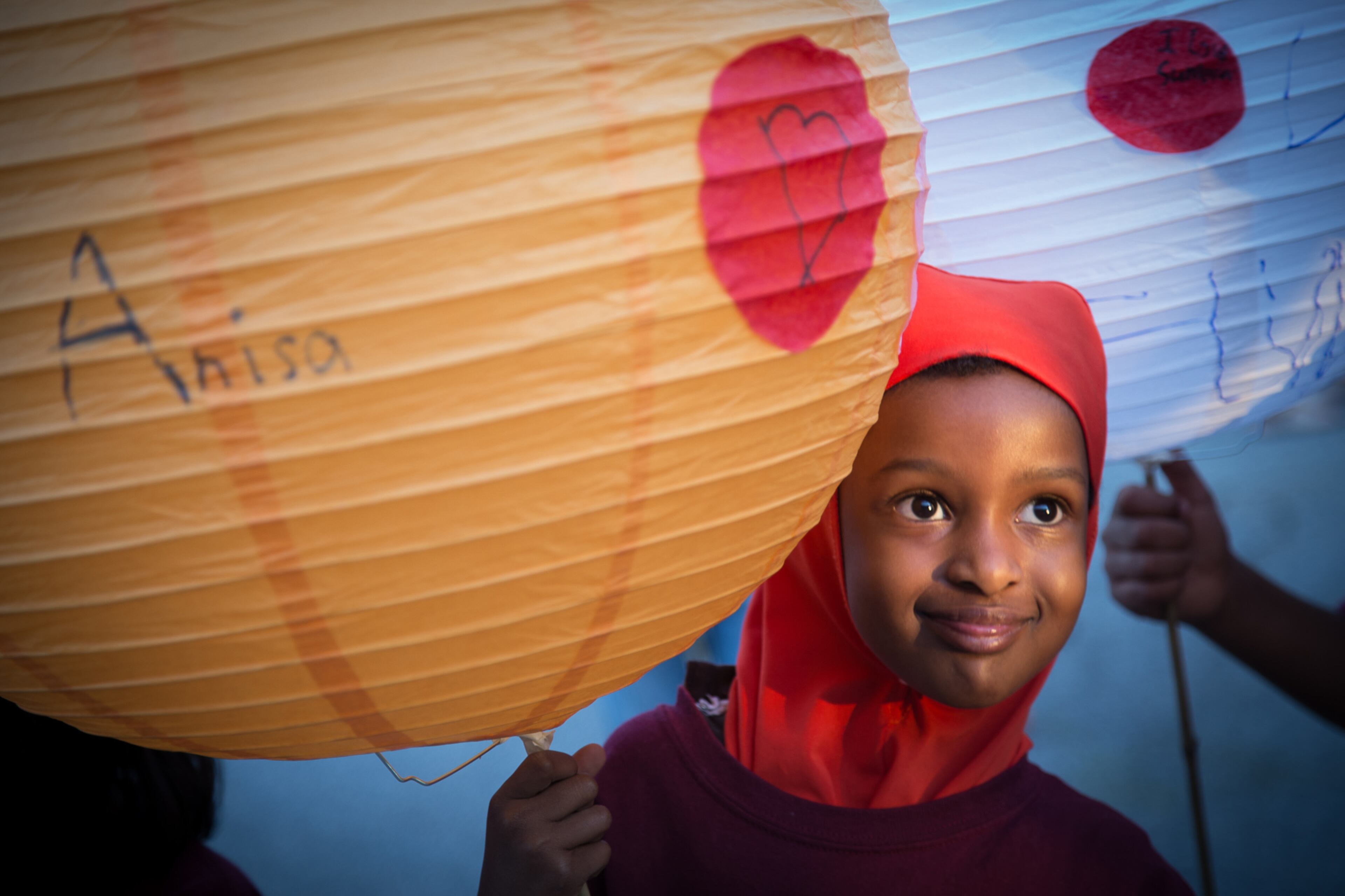 READY FOR THE LIGHT--Anisa Sharif holds her handmade lantern before the start of the Decatur Lantern Parade in Decatur, GA Friday night. STEVE SCHAEFER / SPECIAL TO THE AJC