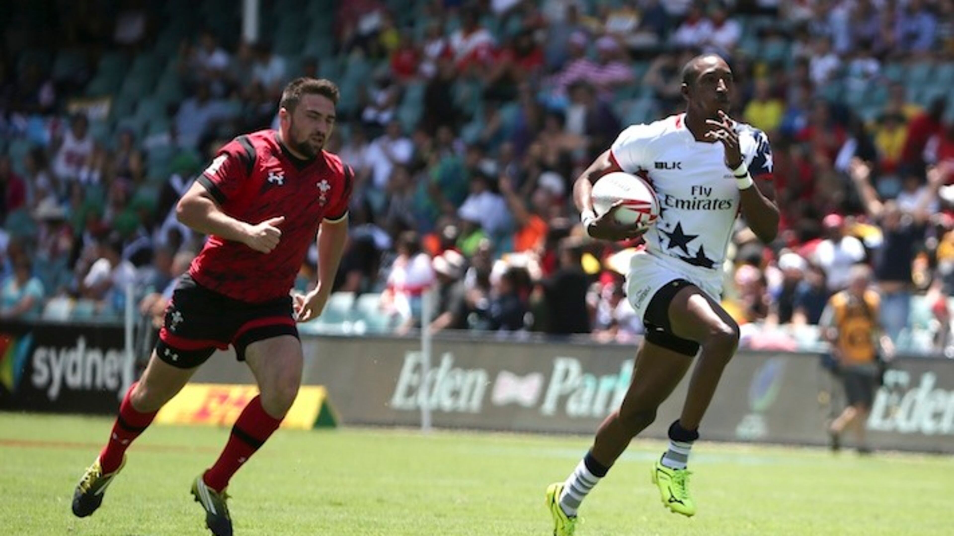 Perry Baker of U.S. right, breaks aways to score a try during the World Rugby 7's Series match against Wales in Sydney, Australia, Saturday, Feb. 6, 2016.(AP Photo/Rob Griffith)
