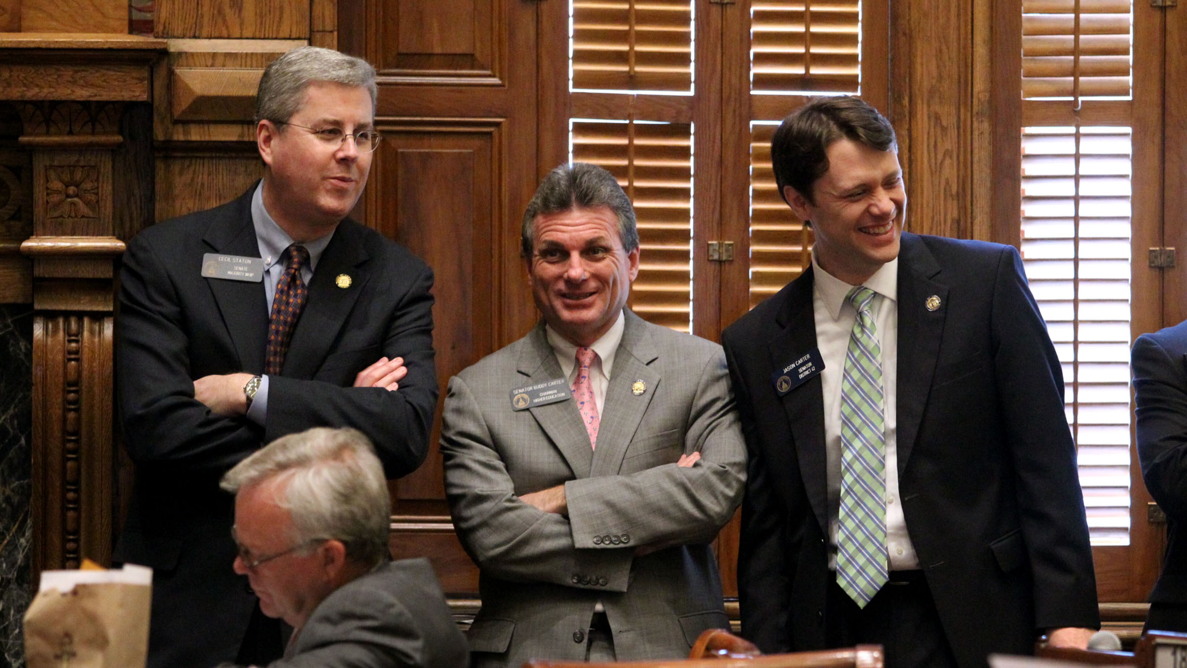 Feb. 2, 2012-ATLANTA: Senators Cecil Staton, R-Macon, left, Buddy Carter, R-Pooler, and Jason Carter, D-Decatur, right, laugh during Legislative Day 13 in the Senate Chambers Thursday morning in Atlanta, Ga., February 2, 2012. Jason Getz jgetz@ajc.com