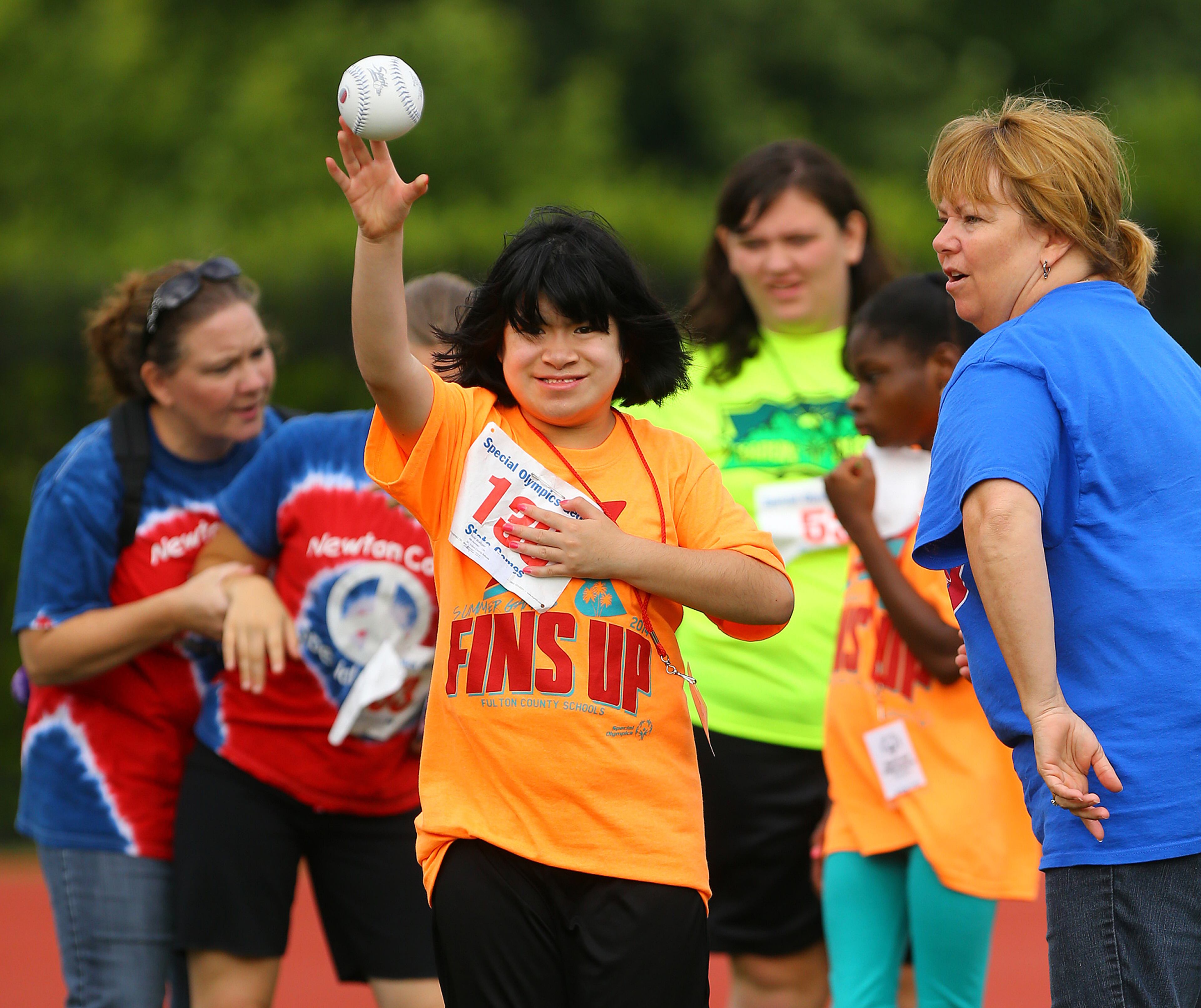 Kelsi Bollinger, 14, Fulton County Schools, makes her toss with a smile in the softball throw during the Special Olympics Georgia State Summer Games at Emory University on Sunday, June 1, 2014, in Atlanta. Nearly 3,000 athletes, coaches and unified partners participated over the weekend.