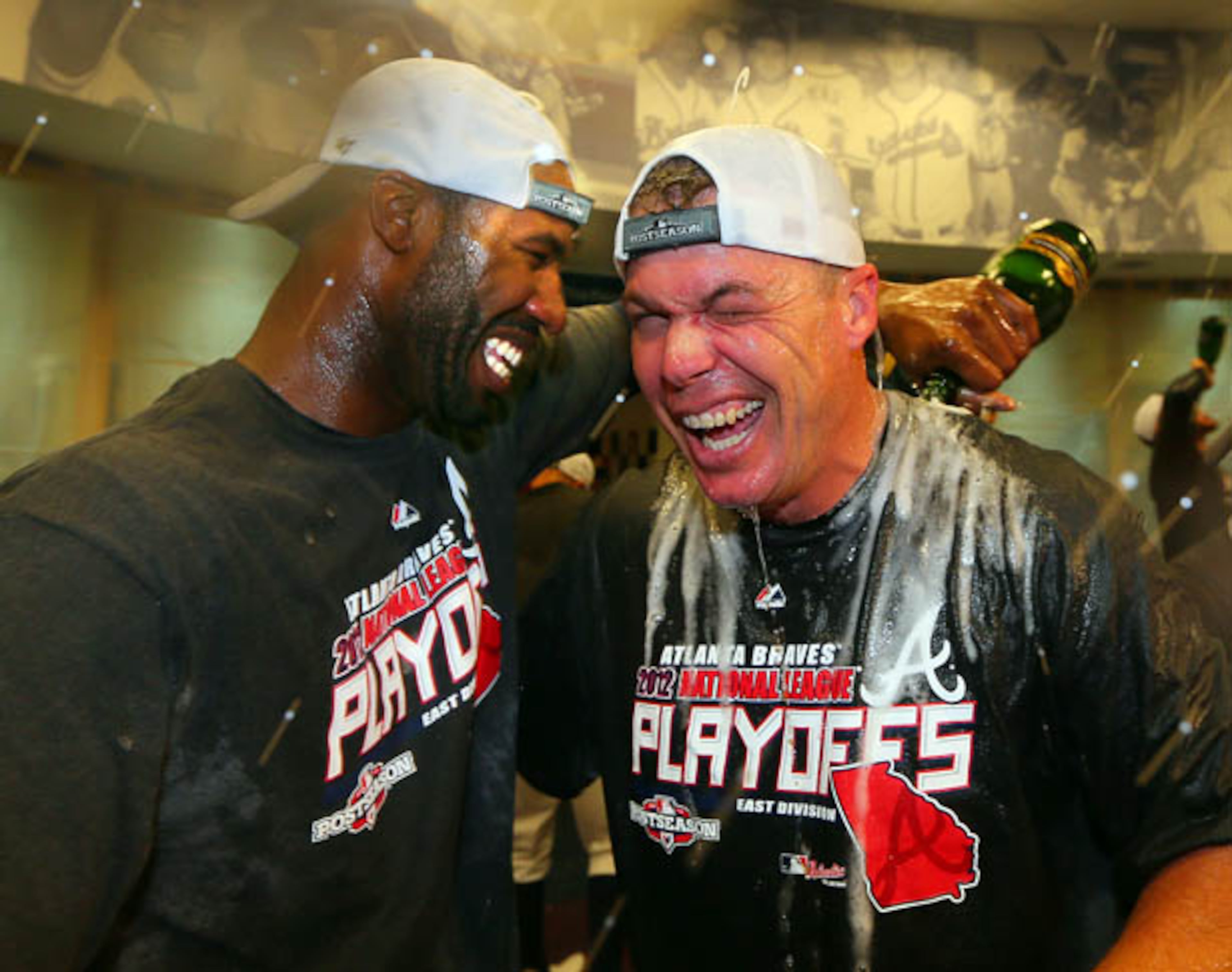 Sept. 25: Jason Heyward pours champagne over Chipper Jones in the Braves clubhouse as the team celebrates clinching a playoff spot.