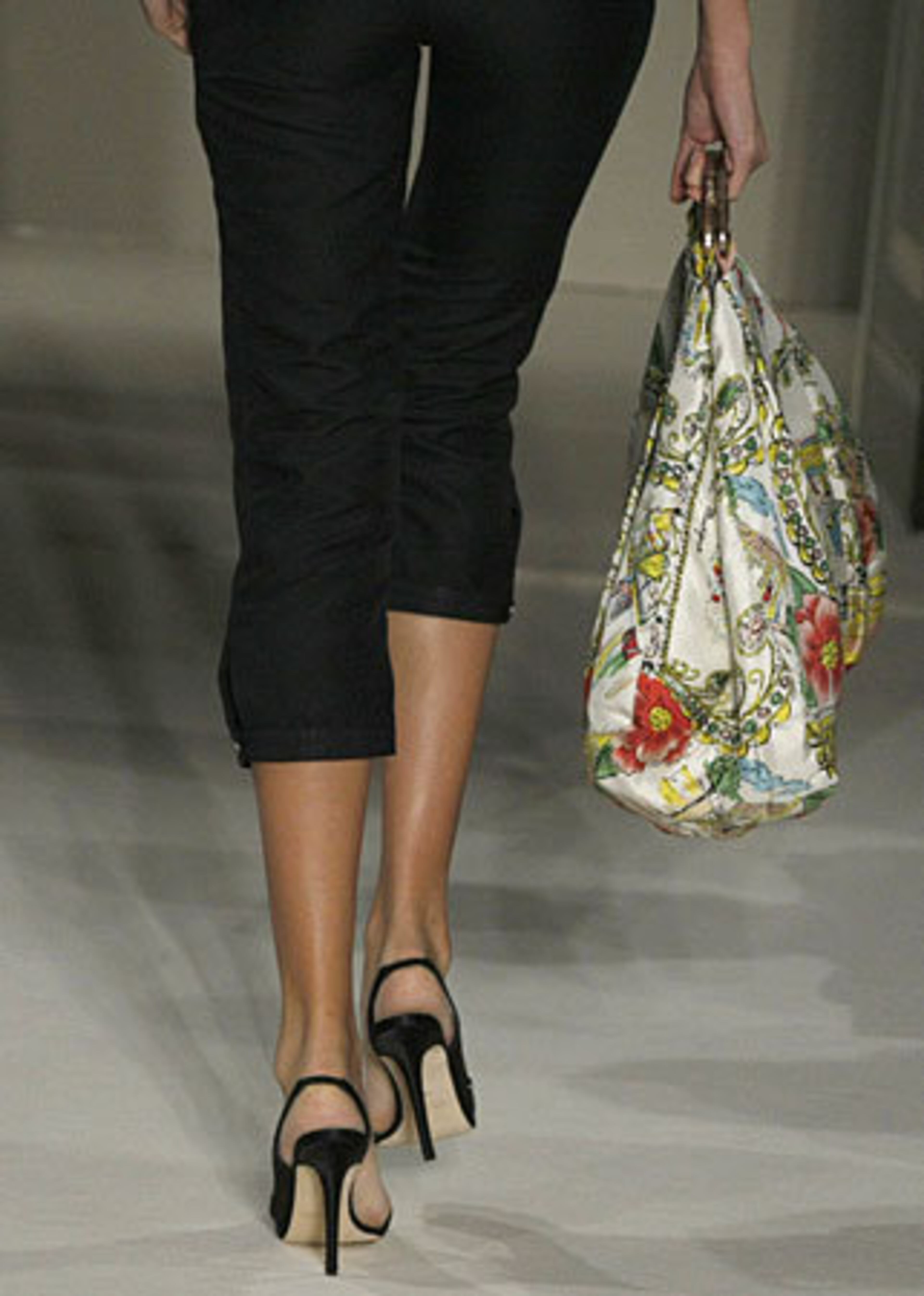 A model wears a creation for Australian fashion designer Collette Dinnigan's spring/summer 2011 ready-to-wear fashion collection presented in Paris, Tuesday, Oct. 5, 2010.