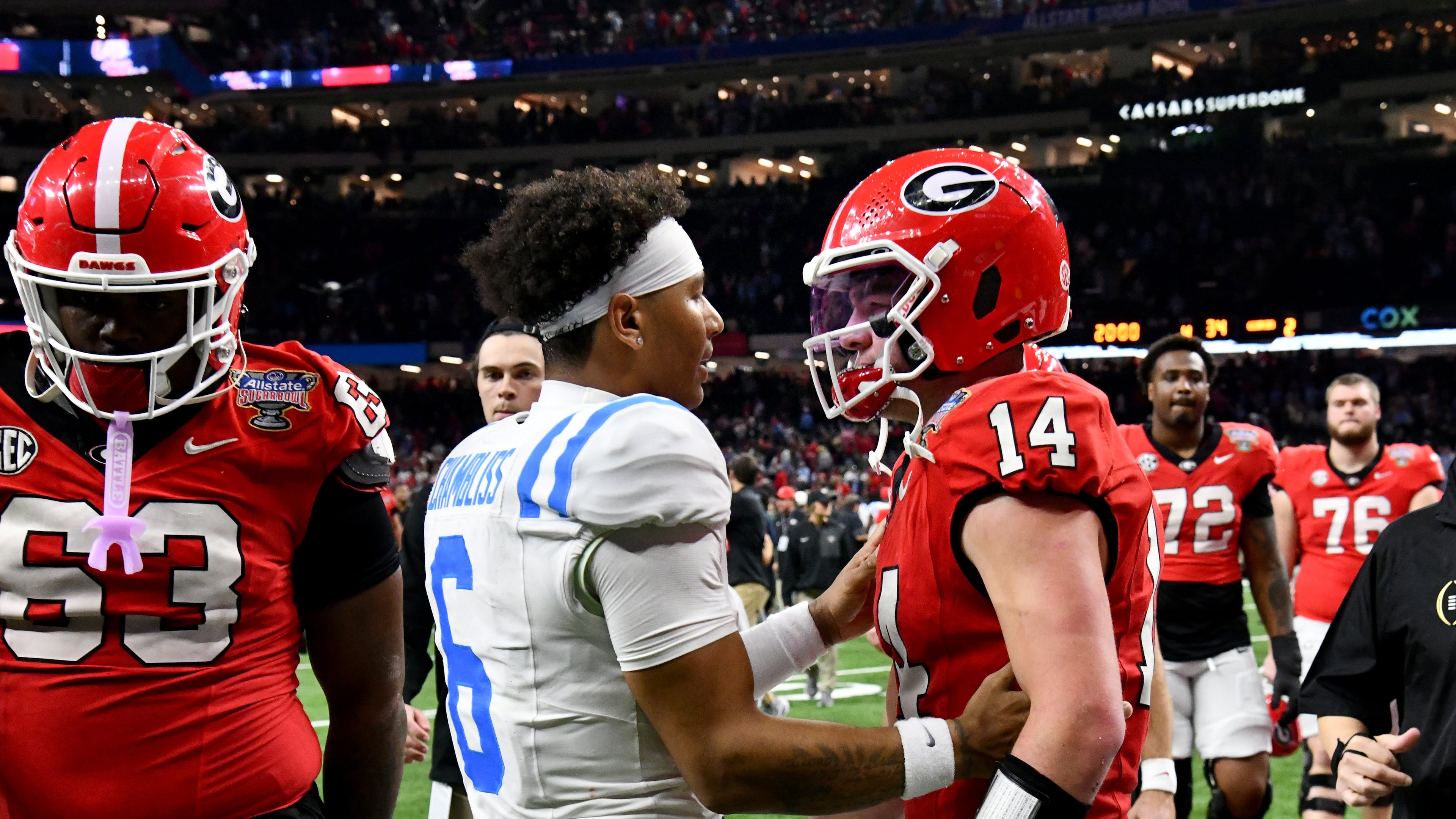 Georgia quarterback Gunner Stockton (right) and Ole Miss quarterback Trinidad Chambliss greet each other after Ole Miss beat Georgia during the Sugar Bowl on Jan. 1, 2026, in New Orleans. (Hyosub Shin/AJC)
