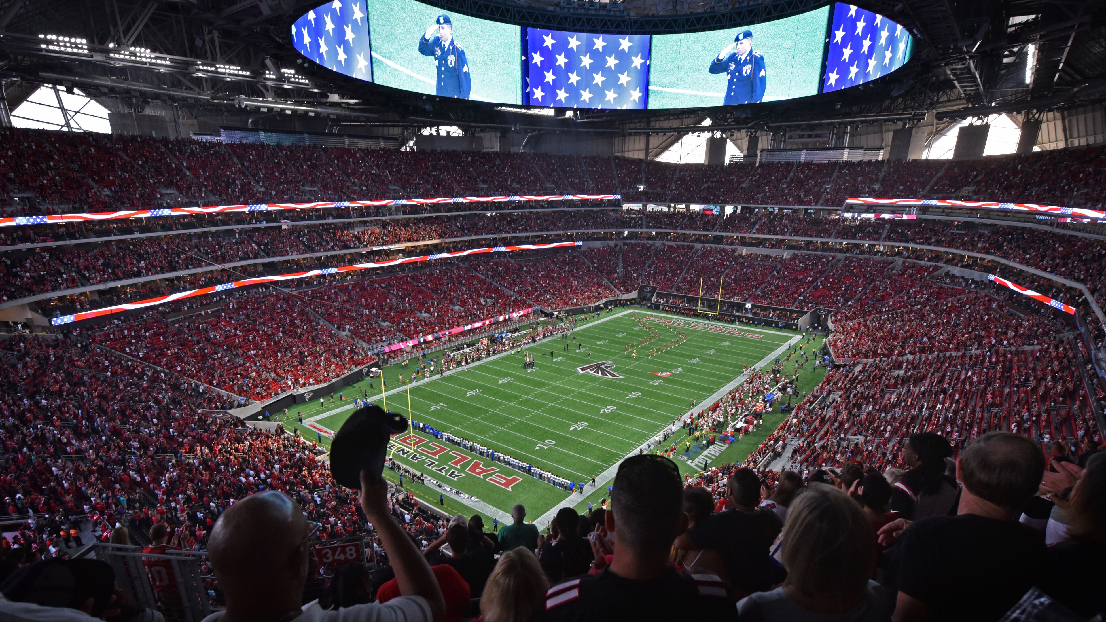 Fans stand for the national anthem before an exhibition game against the Arizona Cardinals at the new Mercedes-Benz Stadium on Saturday, Aug. 26, 2017, in Atlanta.