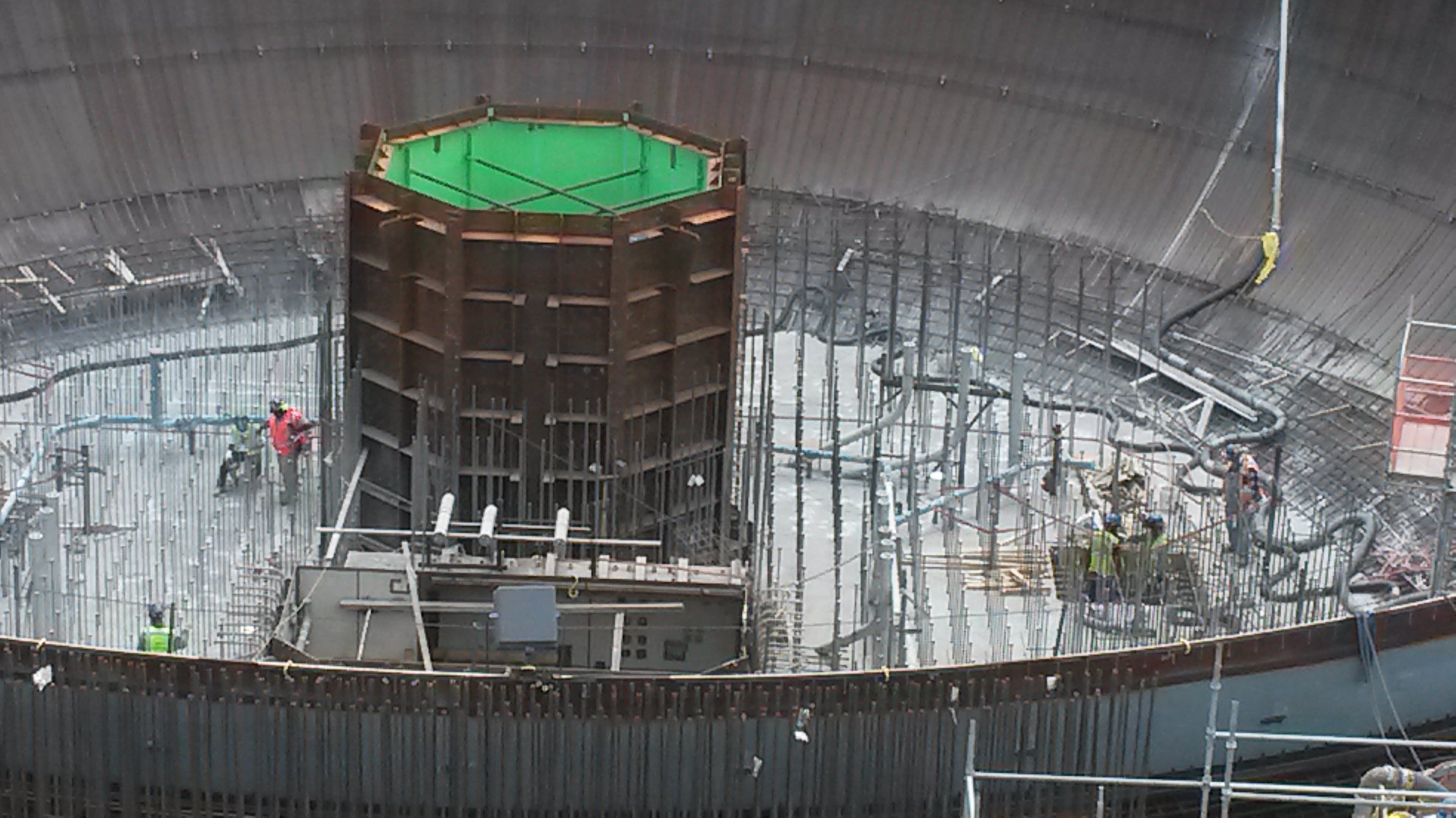 Here's a close up of a reactor vessel cavity module at Plant Vogtle. It will hold the metal vessel. Inside the vessel is where nuclear reactions will take place for one of the plant's two new units. Notice some construction workers standing outside the module. The entire rebar-covered area where they are standing will be covered in about 40' of concrete. MATT KEMPNER / MKEMPNER@AJC.COM