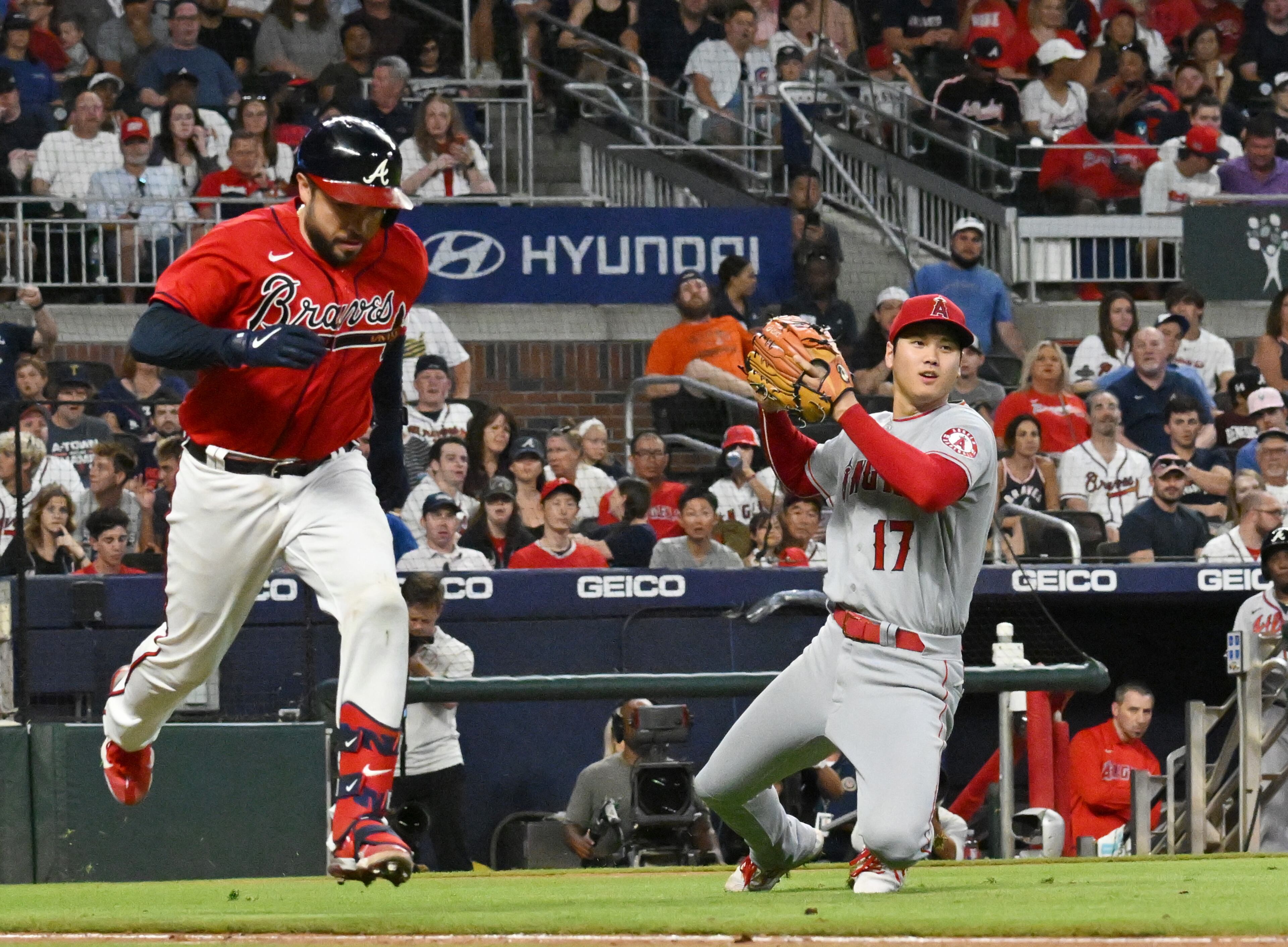 Los Angeles Angels' starting pitcher Shohei Ohtani (17) throws to the first base to put out Atlanta Braves' catcher Travis d'Arnaud (16) in the 5th inning at Truist Park on Friday, July 22, 2022. (Hyosub Shin / Hyosub.Shin@ajc.com)