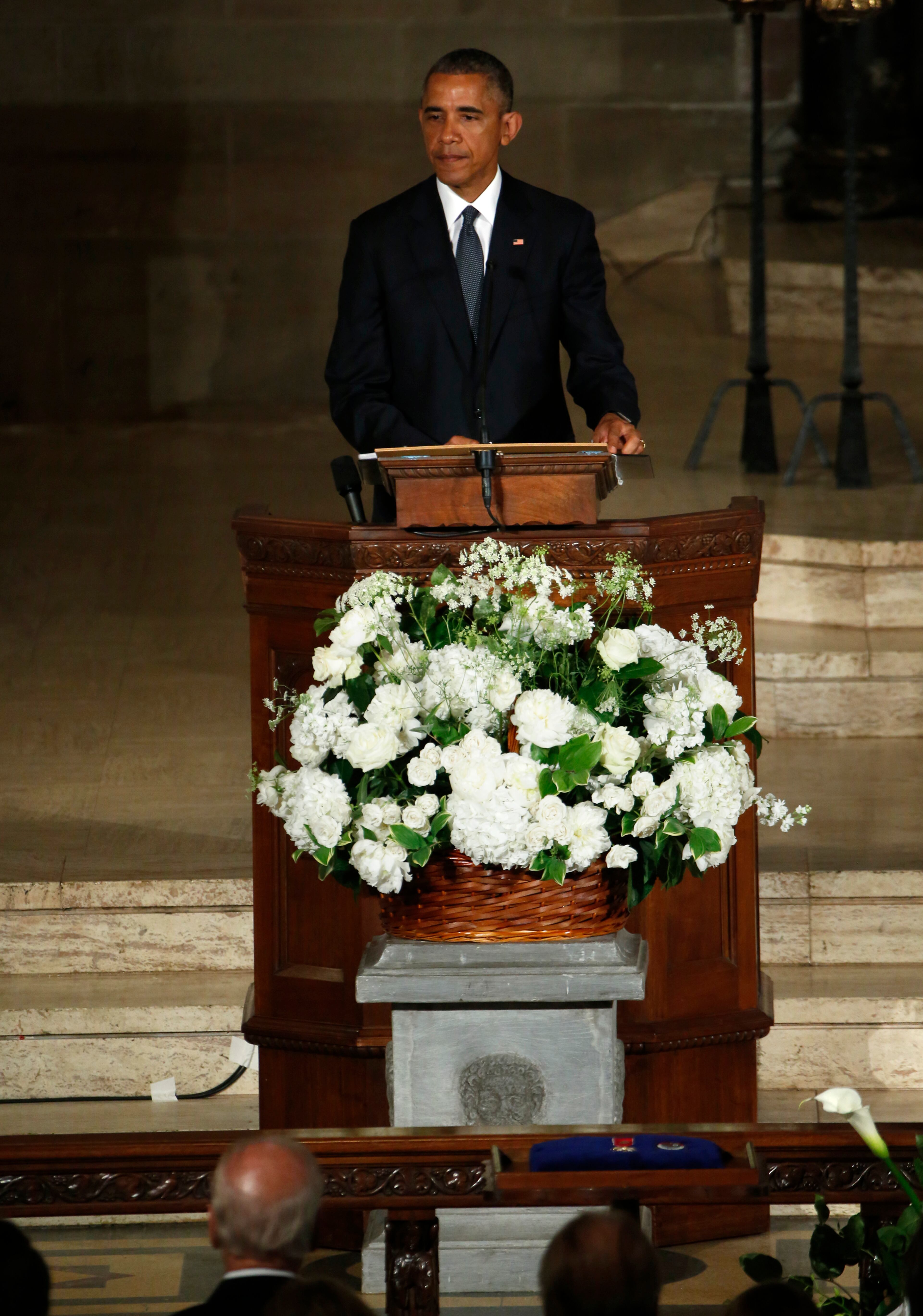 President Barack Obama delivers the eulogy in honor of former Delaware Attorney General Beau Biden, Saturday, June 6, 2015, at St. Anthony of Padua Church in Wilmington, Del. Biden, Vice President Joe Biden's eldest son, died at the age of 46 after a battle with brain cancer. (YurinGripas/Pool Photo via AP)