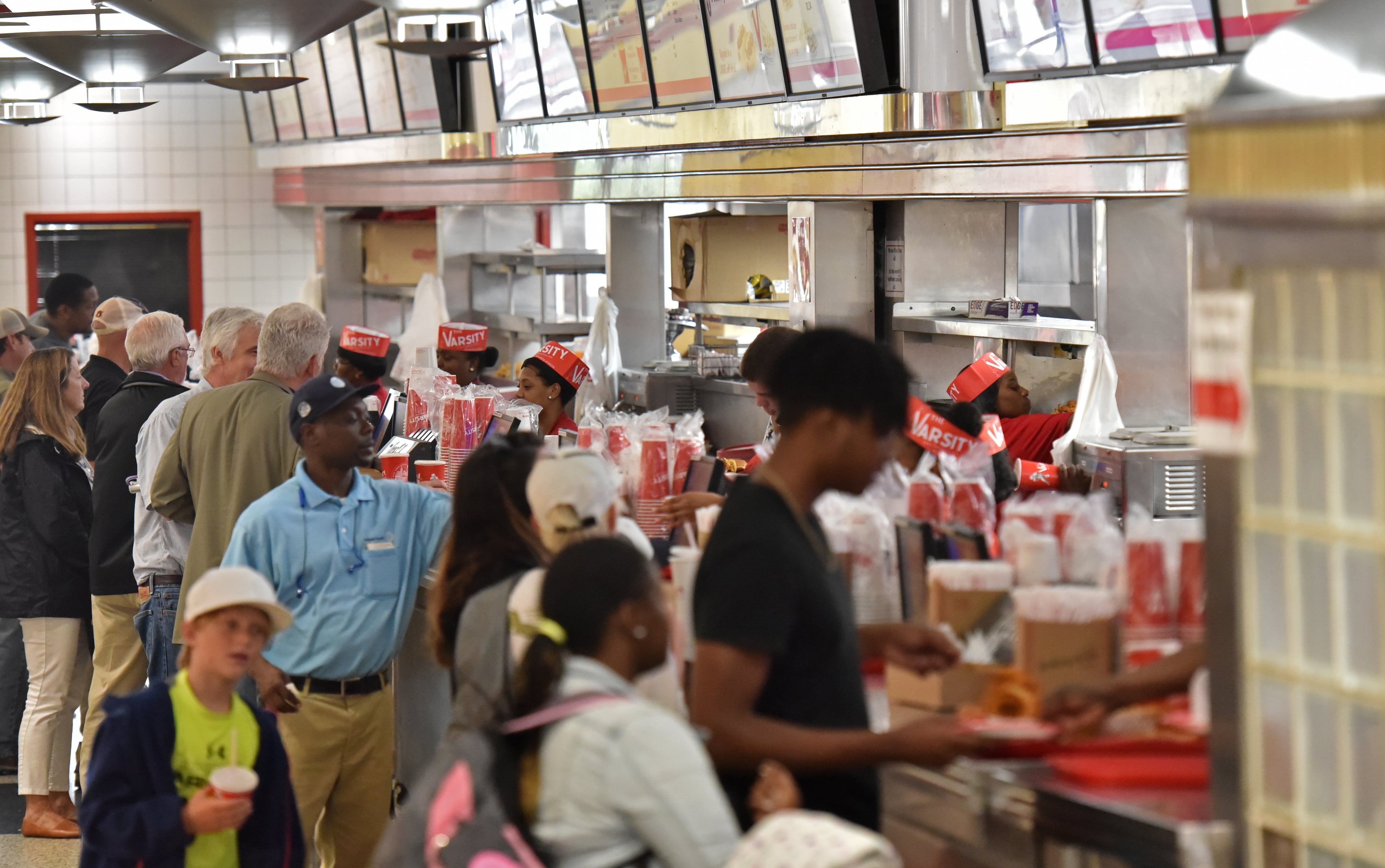 August 2, 2018 Atlanta - The Varsity is packed with customers on Thursday, August 2, 2018. Gordon Muir, president, and his daughter Ashley Weiser, marketing director, at the Midtown Varsity, representing the third and fourth generations of the Gordy family at the Varsity. The Varsity is turning 90. HYOSUB SHIN / HSHIN@AJC.COM