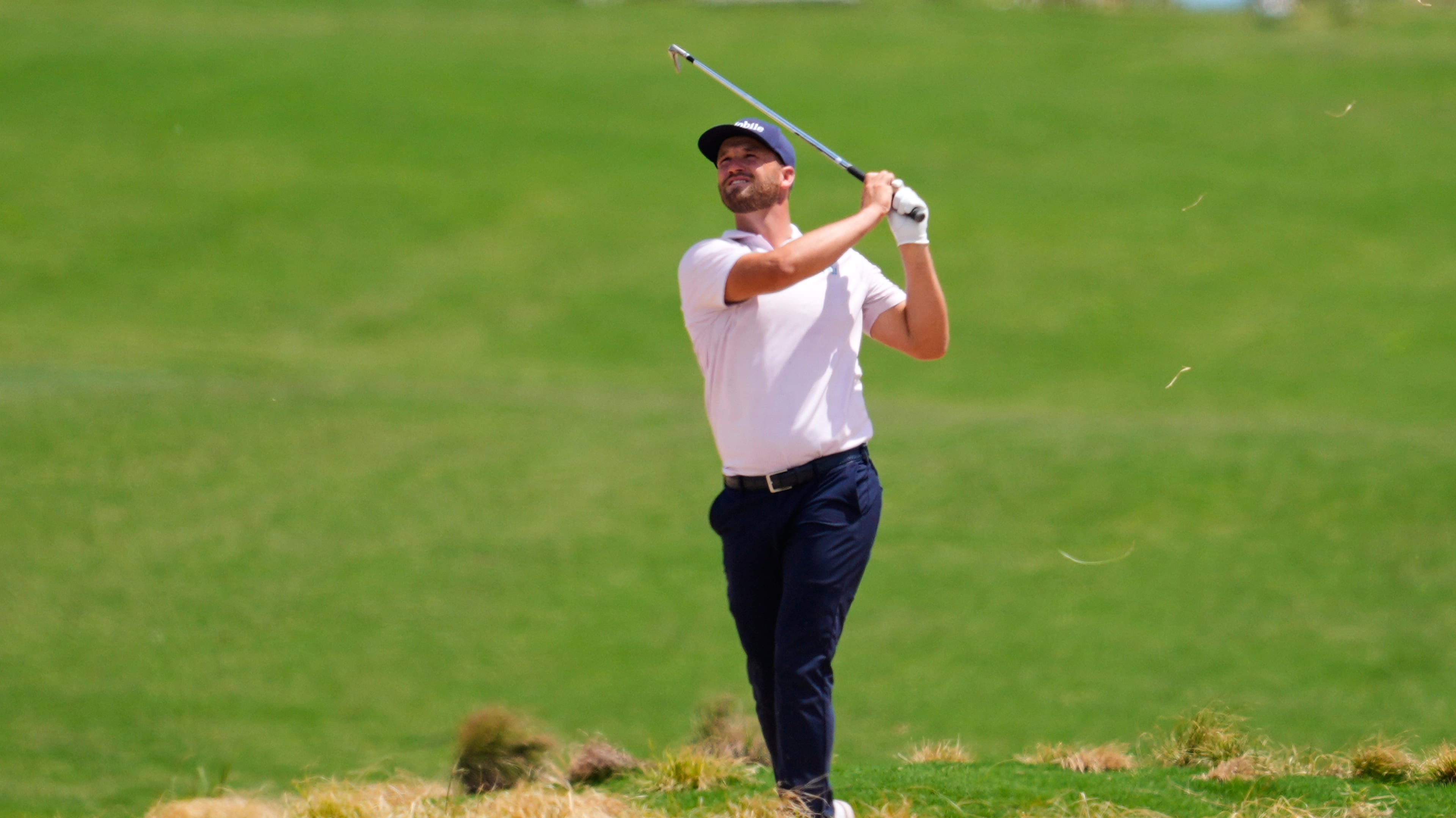 Wyndham Clark watches his shot out of a hazard on the 10th fairway during the final round of the CJ Cup Byron Nelson golf tournament in McKinney, Texas, Sunday, May 24, 2026. (AP Photo/Tony Gutierrez)