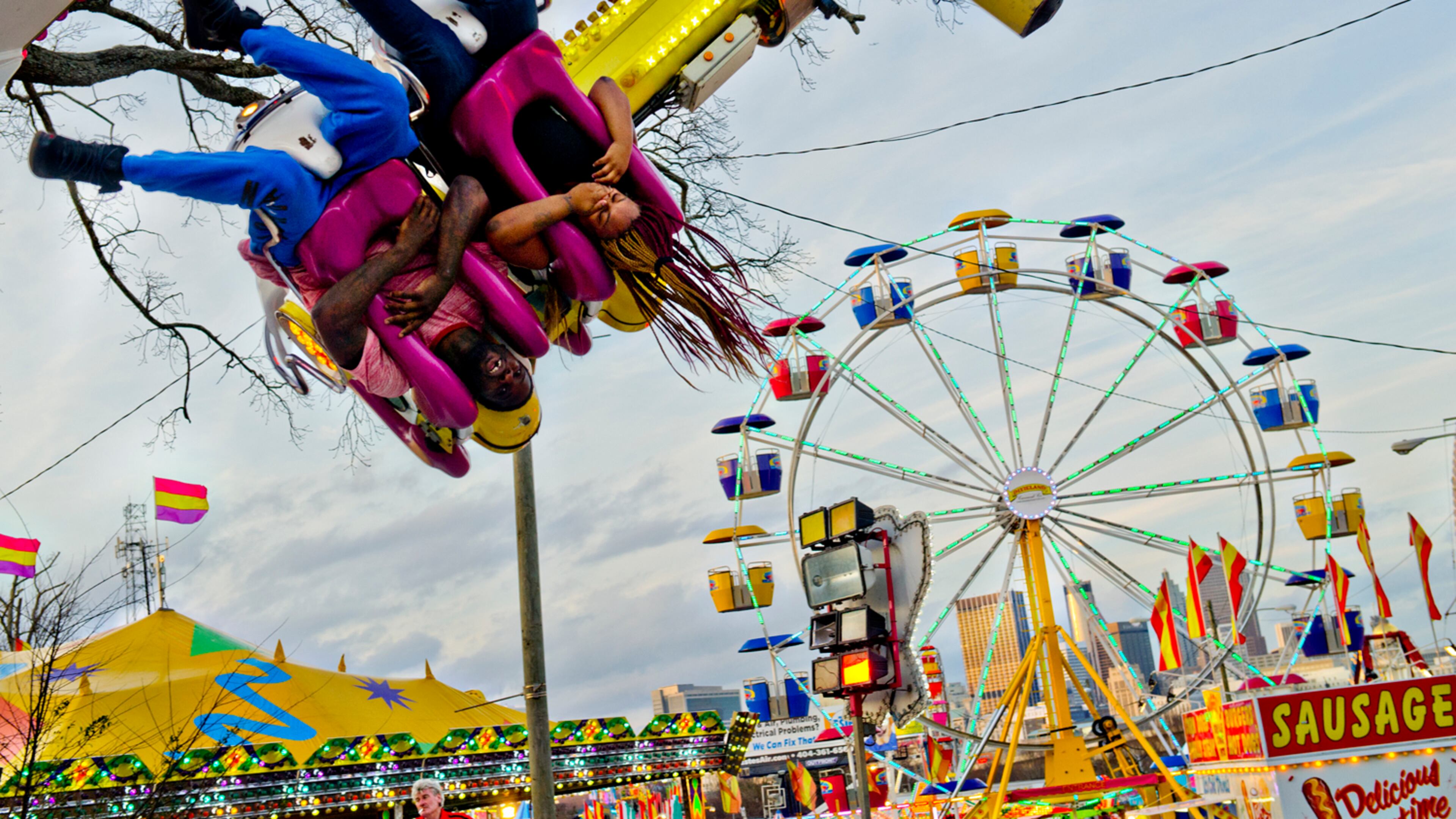 A FAIR EXPERIENCE--March 4, 2015 Atlanta - Christopher Watson (left) and Alisha Medley hang upside down as they ride Experience at the Atlanta Fair on Wednesday, March 4, 2015. The fair runs through April 5. JONATHAN PHILLIPS / SPECIAL