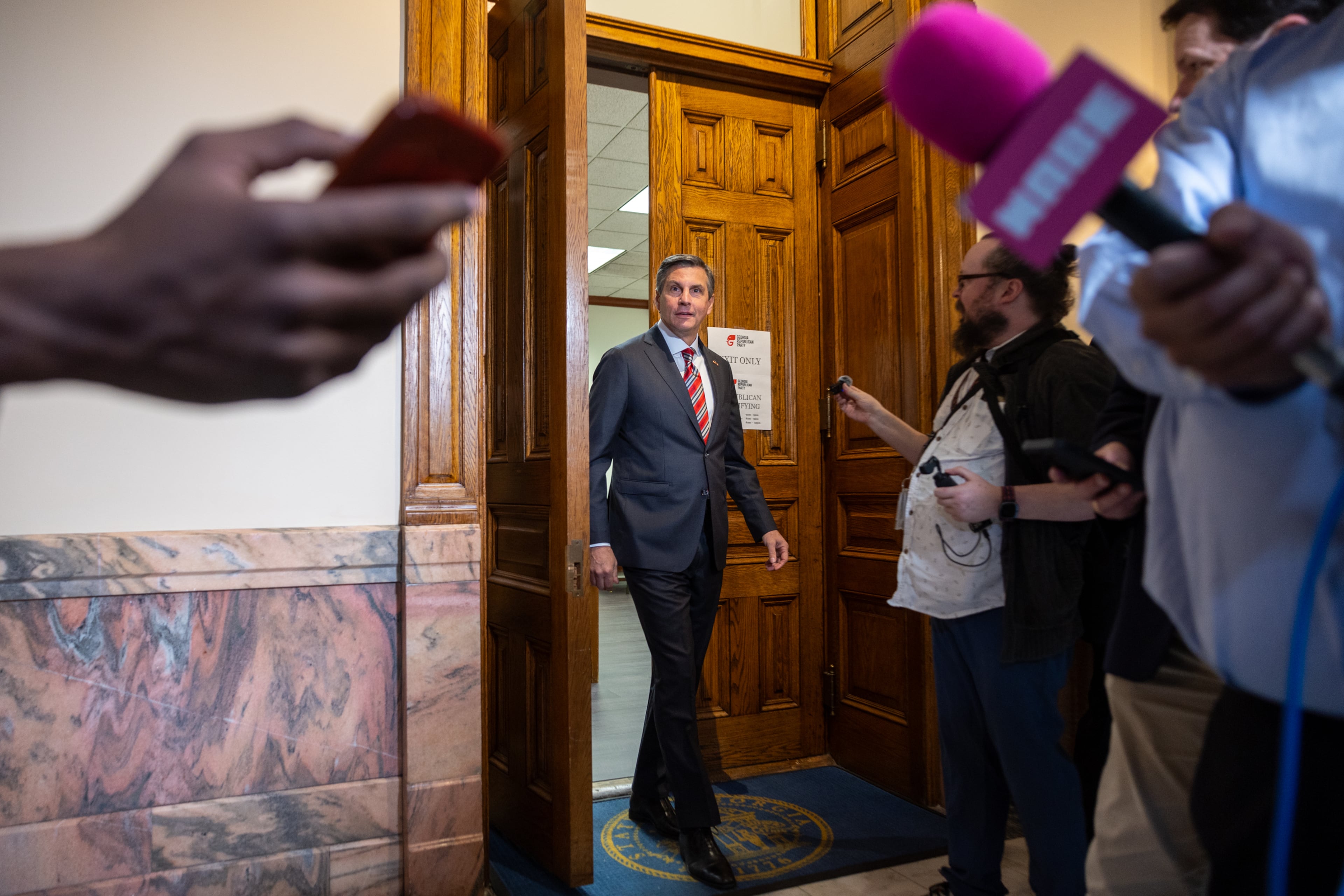 Republican candidate for U.S. Senate Derek Dooley speaks to reporters after filing paperwork to run for election at the Capitol in March. (Arvin Temkar/AJC)