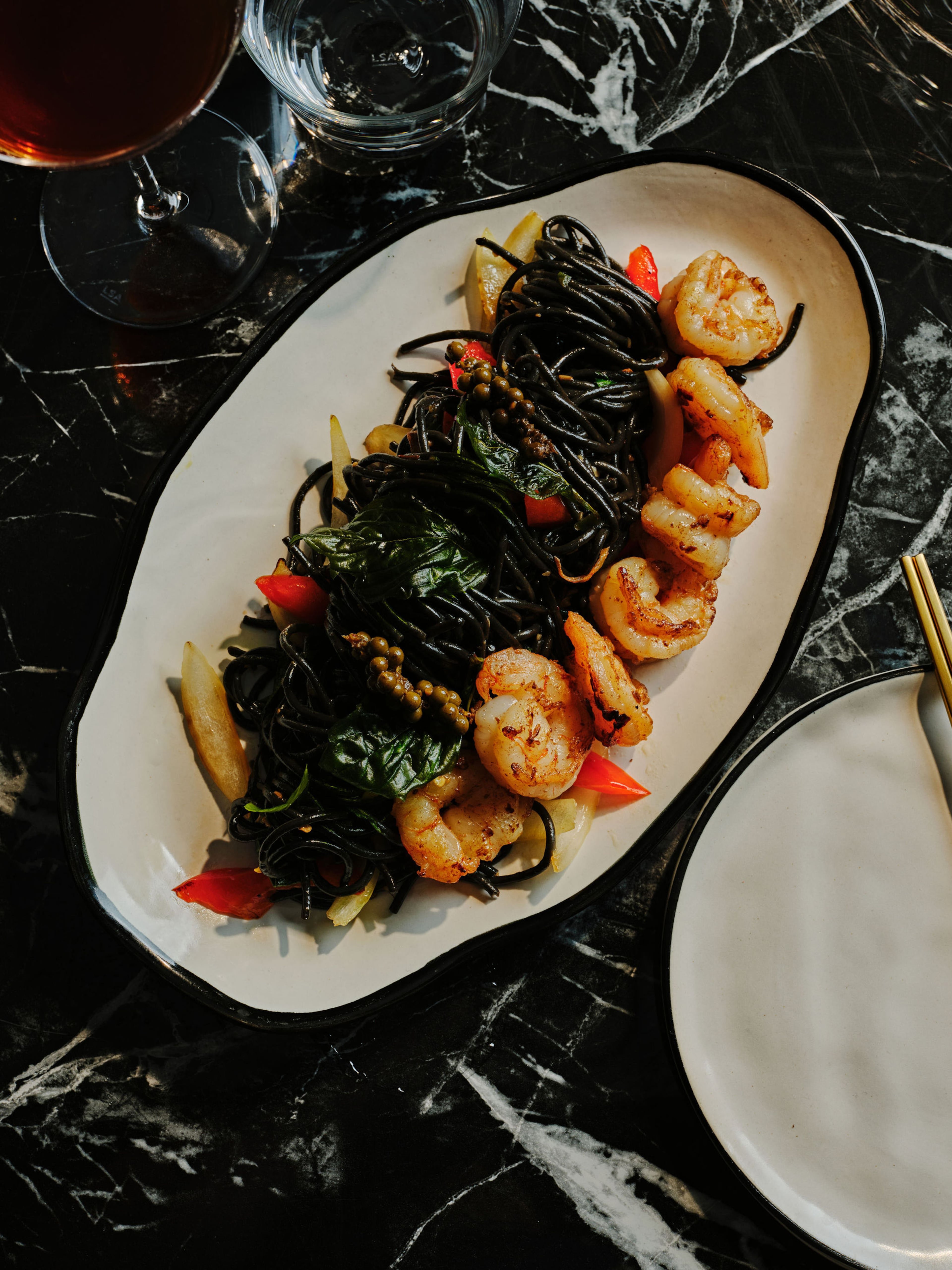 A plate of spicy squid ink spaghetti with shrimp at Blackjack Bar Tapas was neither as spicy as advertised nor as large as expected. (Courtesy of Andrew Thomas Lee/Blackjack Bar Tapas)