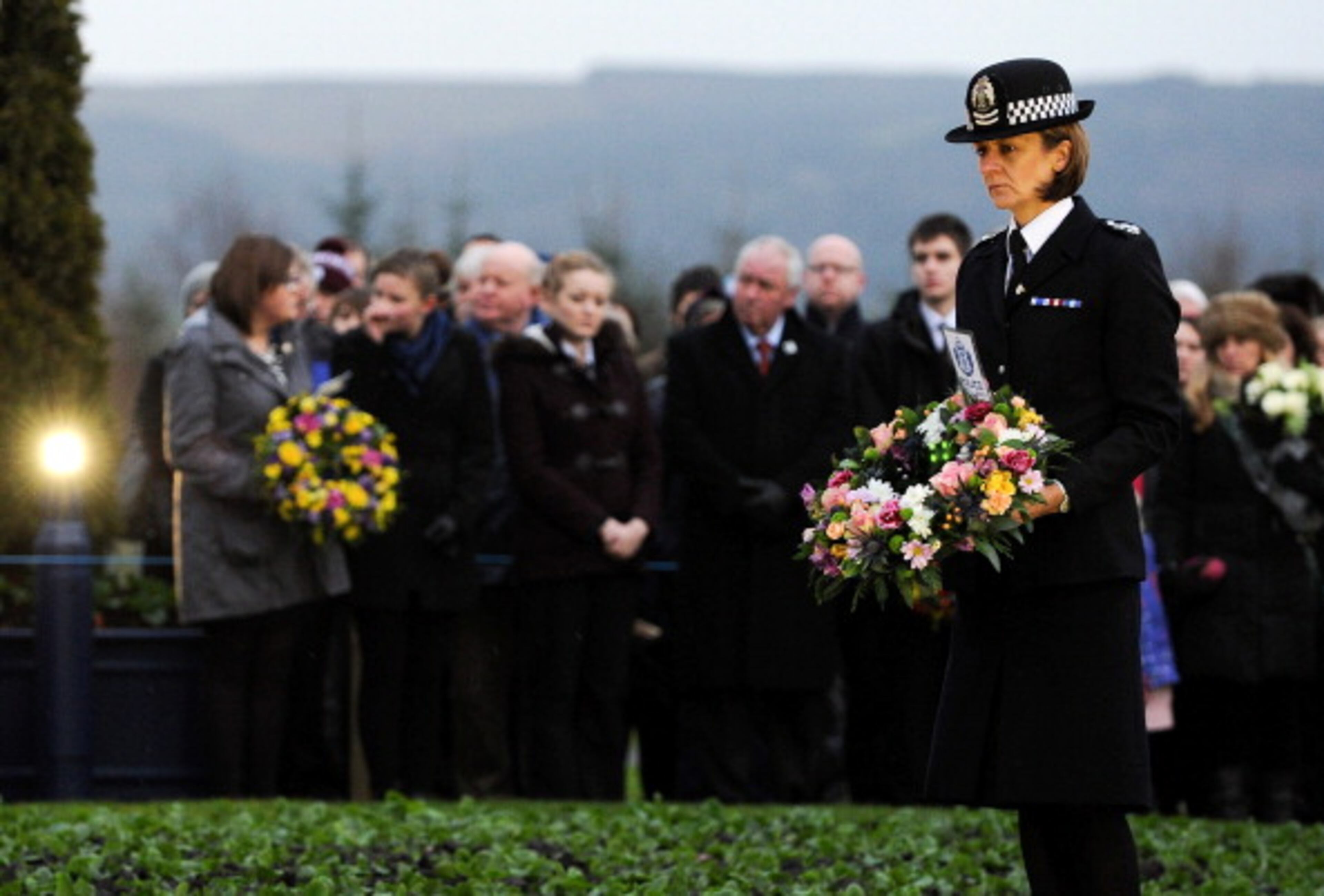 LOCKERBIE, SCOTLAND - DECEMBER 21: Families, relatives and dignitaries gather to pay their respects at the memorial service in Dryfesdale cemetery to commemorate the 25th anniversary of the air disaster on December 21, 2013 in Lockerbie, Scotland. Pan Am Flight 103 exploded over Lockerbie on December 21st, 1988, killing all those on board and a further eleven on the ground. (Photo by Ian Forsyth/Getty Images)