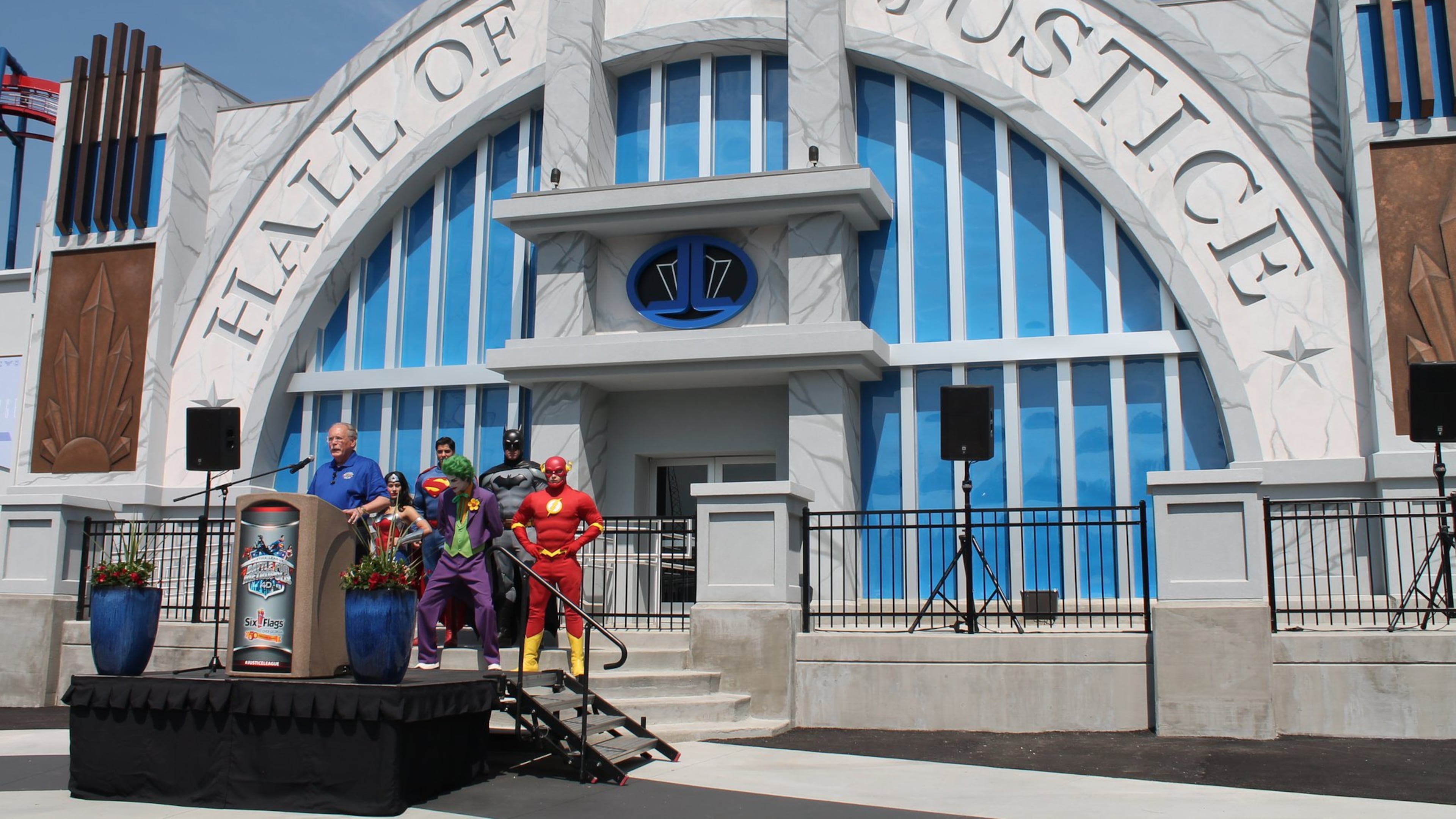 Six Flags Over Georgia President Dale Kaetzel, joined by DC Comics superheroes and villains, introduces the new Justice League: Battle for Metropolis ride at Six Flags Over Georgia on May 11, 2017. TOM KELLEY / TKELLEY@AJC.COM
