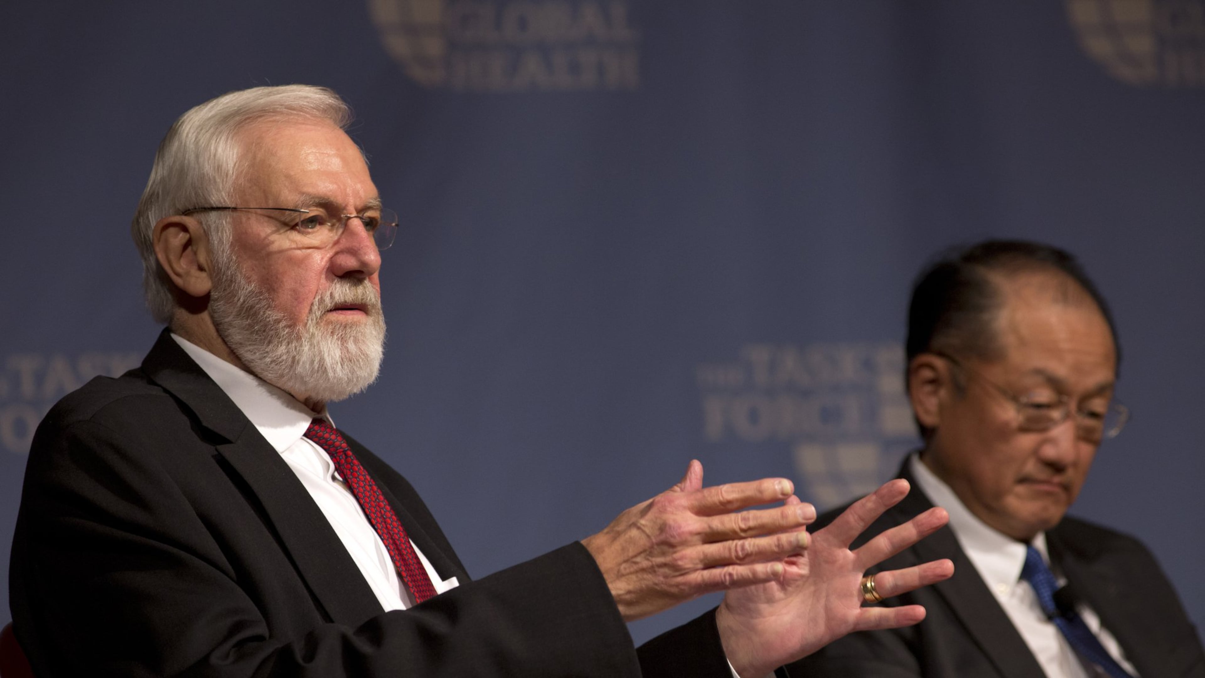 Dr. Bill Foege (left), former director of the Centers for Disease Control and Prevention — pictured speaking alongside World Bank President Dr. Jim Yong Kim at the Carter Center in 2015 — died Saturday, Jan. 24, 2026. (AJC 2015)